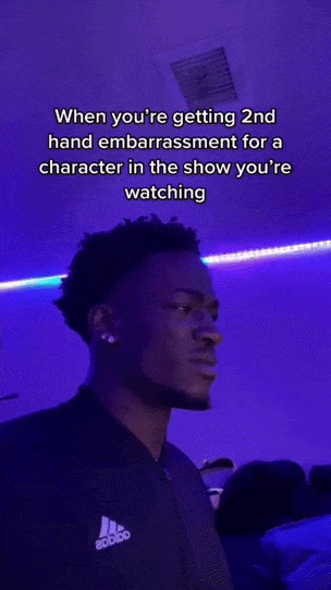 GIF of a tiktok showing a man looking uncomfortable and a caption that reads "When you're getting 2nd hand embarrassment for a character in a show you're watching"