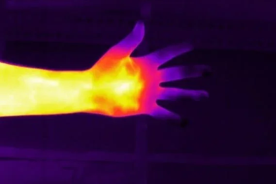 Thermal image of a person's hand on a cold day