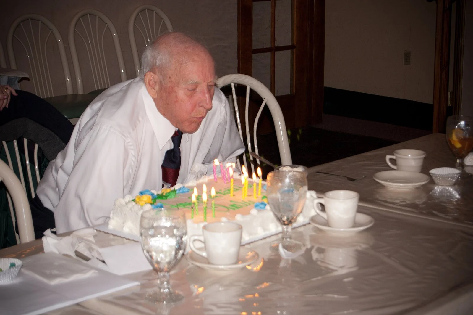86-year old grandpa, Poppy, blows out his birthday candles at a restaurant in New Castle, PA.