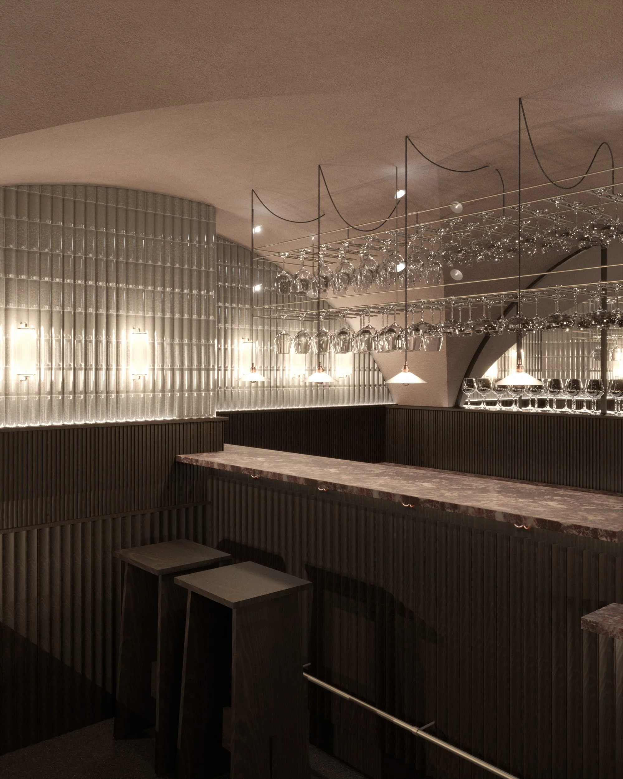 Interior of a modern bar or restaurant with a marble counter, black wooden paneling, and hanging wine glasses. The lighting is warm and ambient.