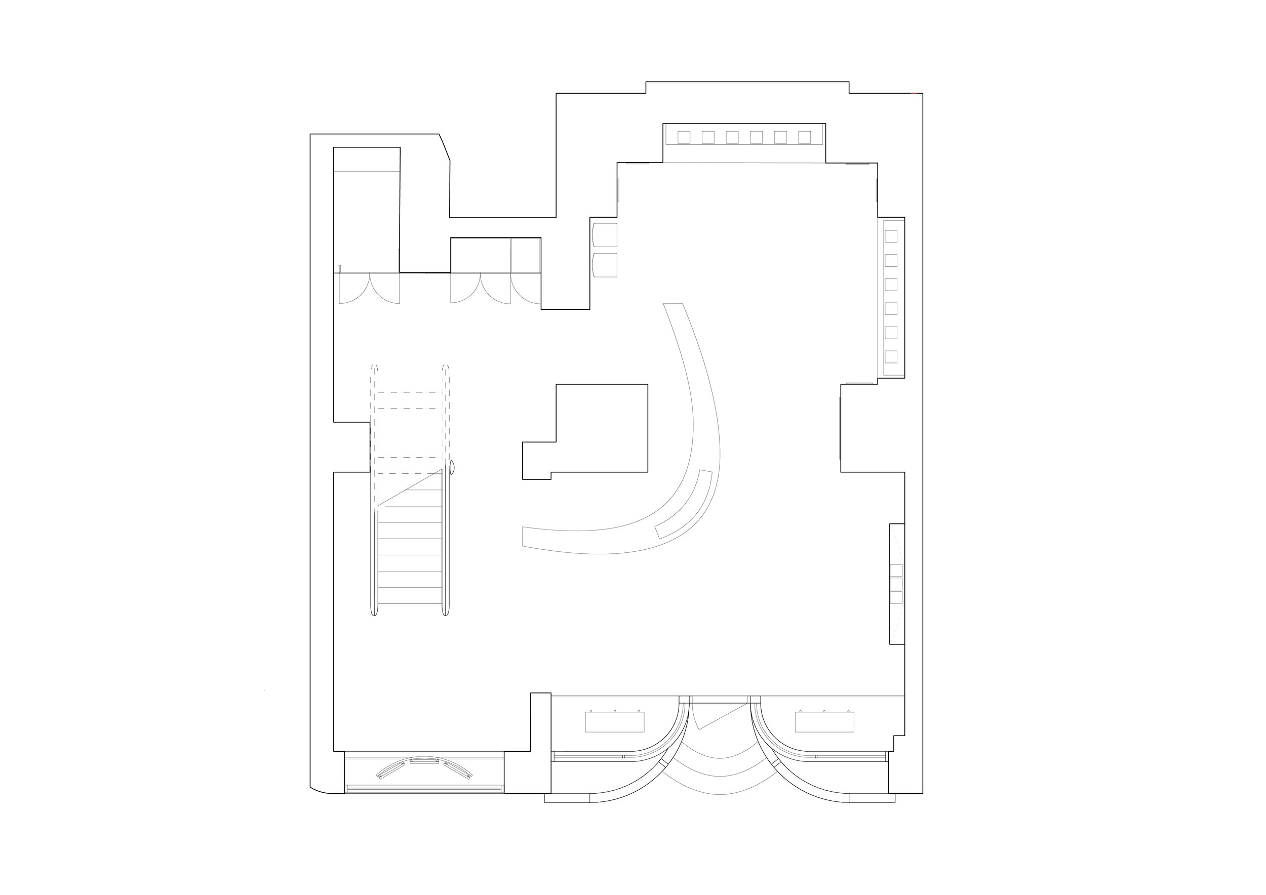 Floor plan of a building with various rooms, stairs, and curved entryways.