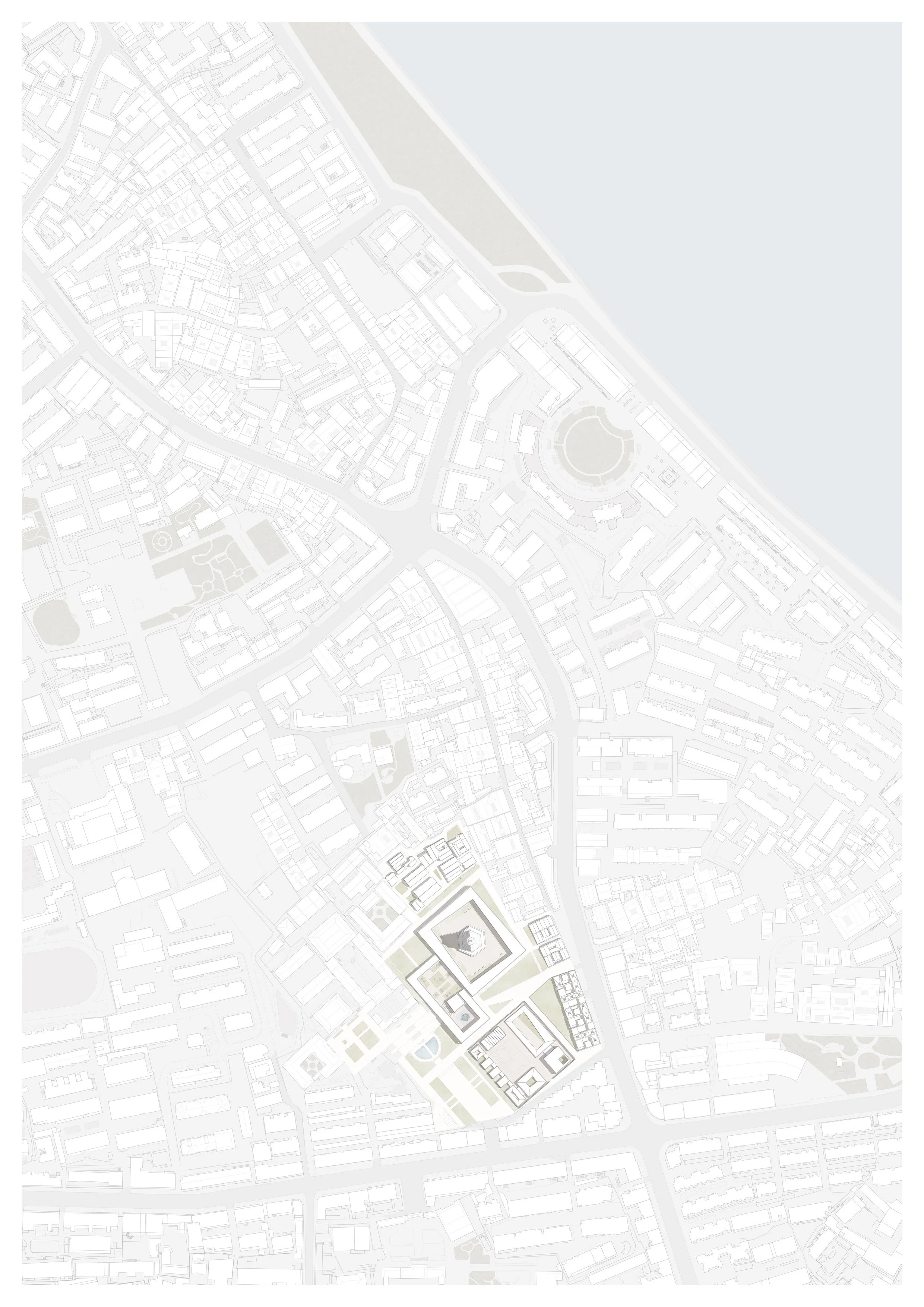 A detailed grayscale map of an urban area showing streets, buildings, and a large body of water on the right side.