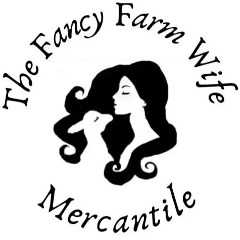 Logo with a silhouette of a woman and a goat, surrounded by the text 'The Fancy Farm Wife Mercantile'