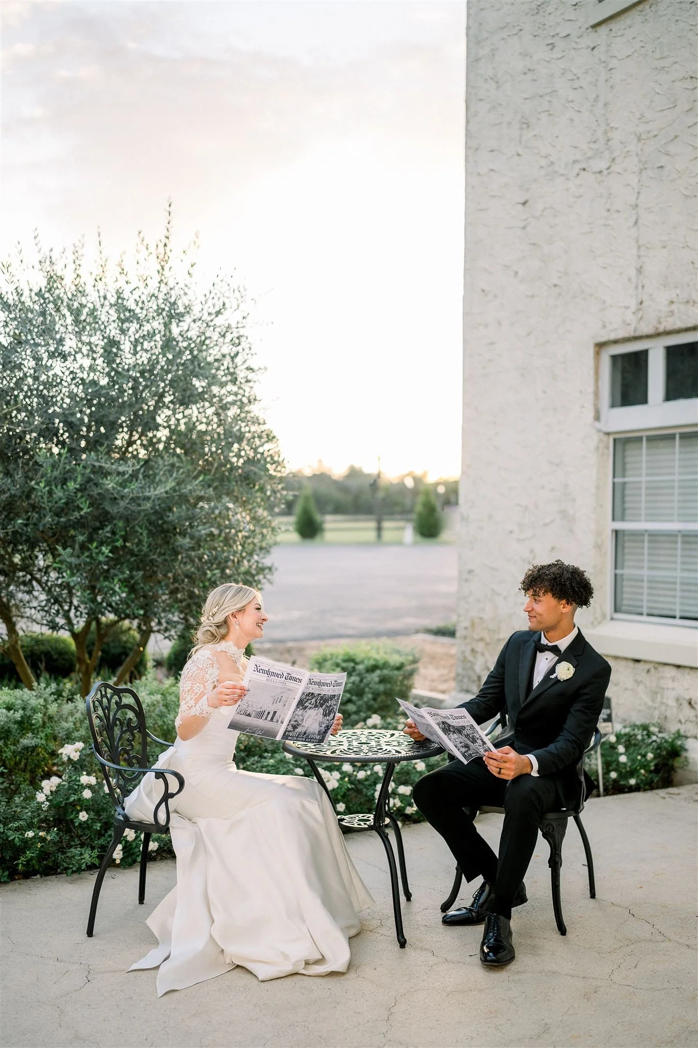 Couple reading journals on a table at Bella Cosa weddings