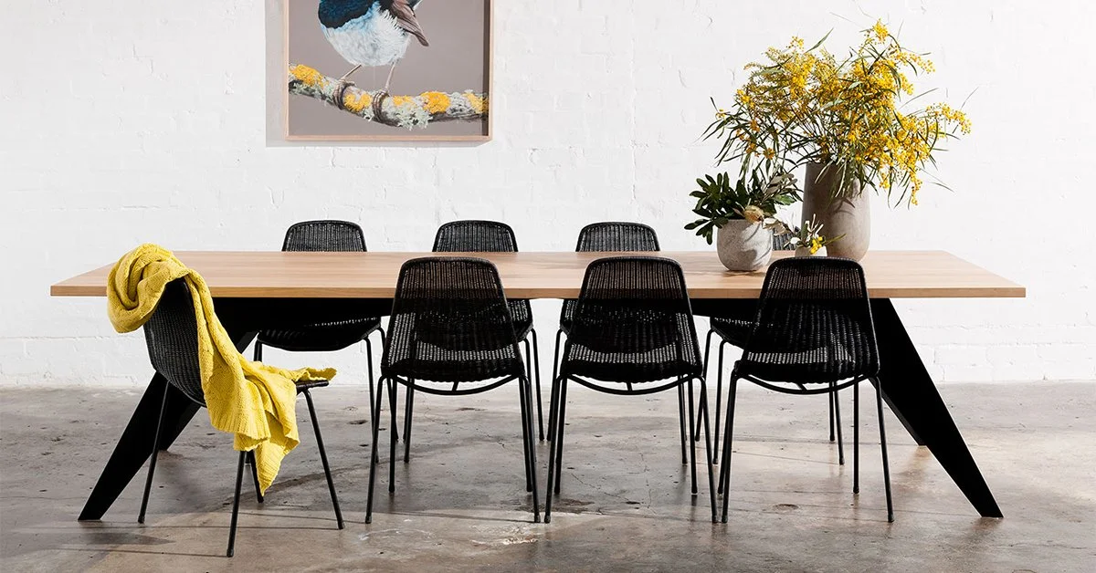 dining table with black metal legs and recycled timber top