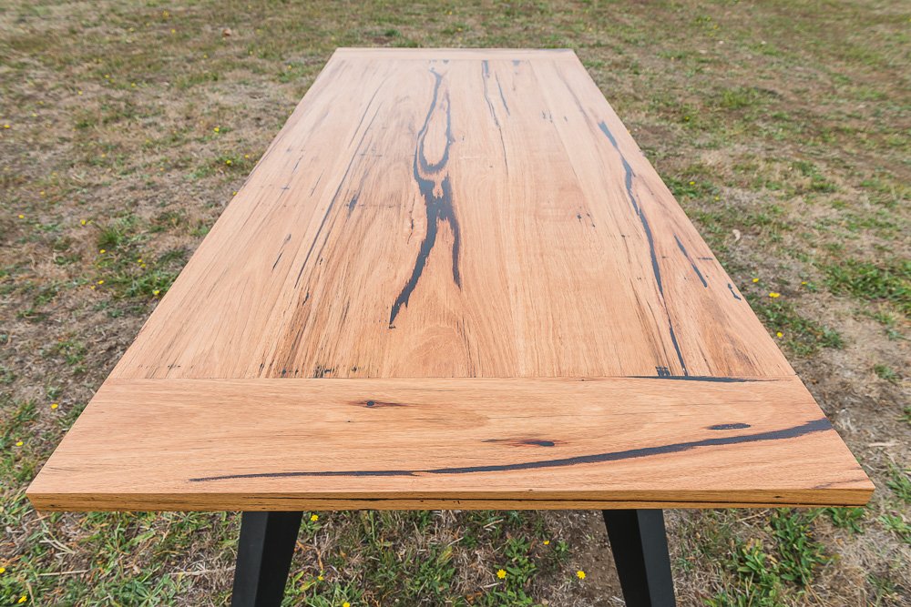 Zeally Bay recycled timber dining table with black angled legs