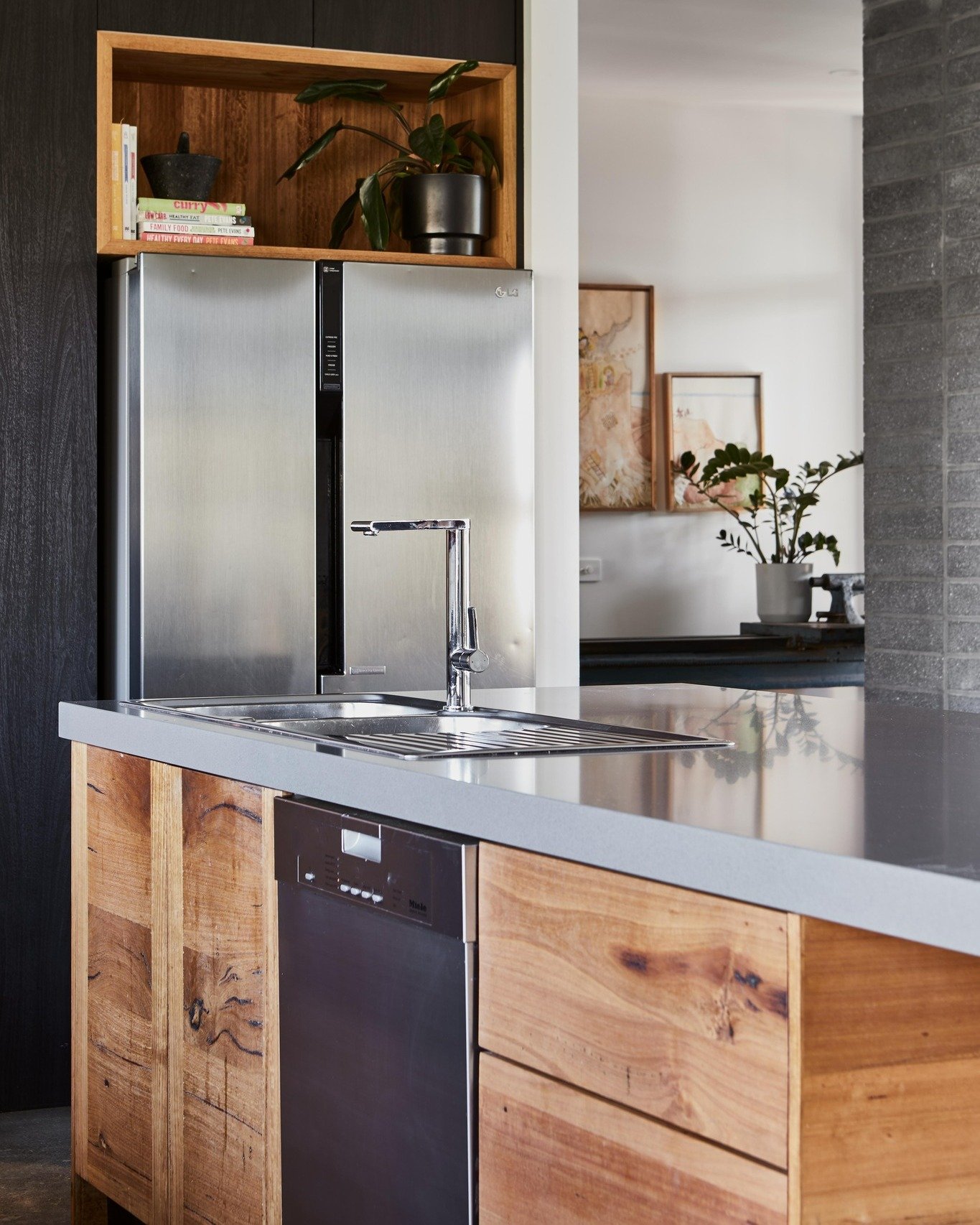 The beautiful Luxe Industrial combination of timber, gray and black... Love how the pops of Messmate timber used throughout this kitchen space brings life to the palette of materials! #kitchendesign #woodenkitchen