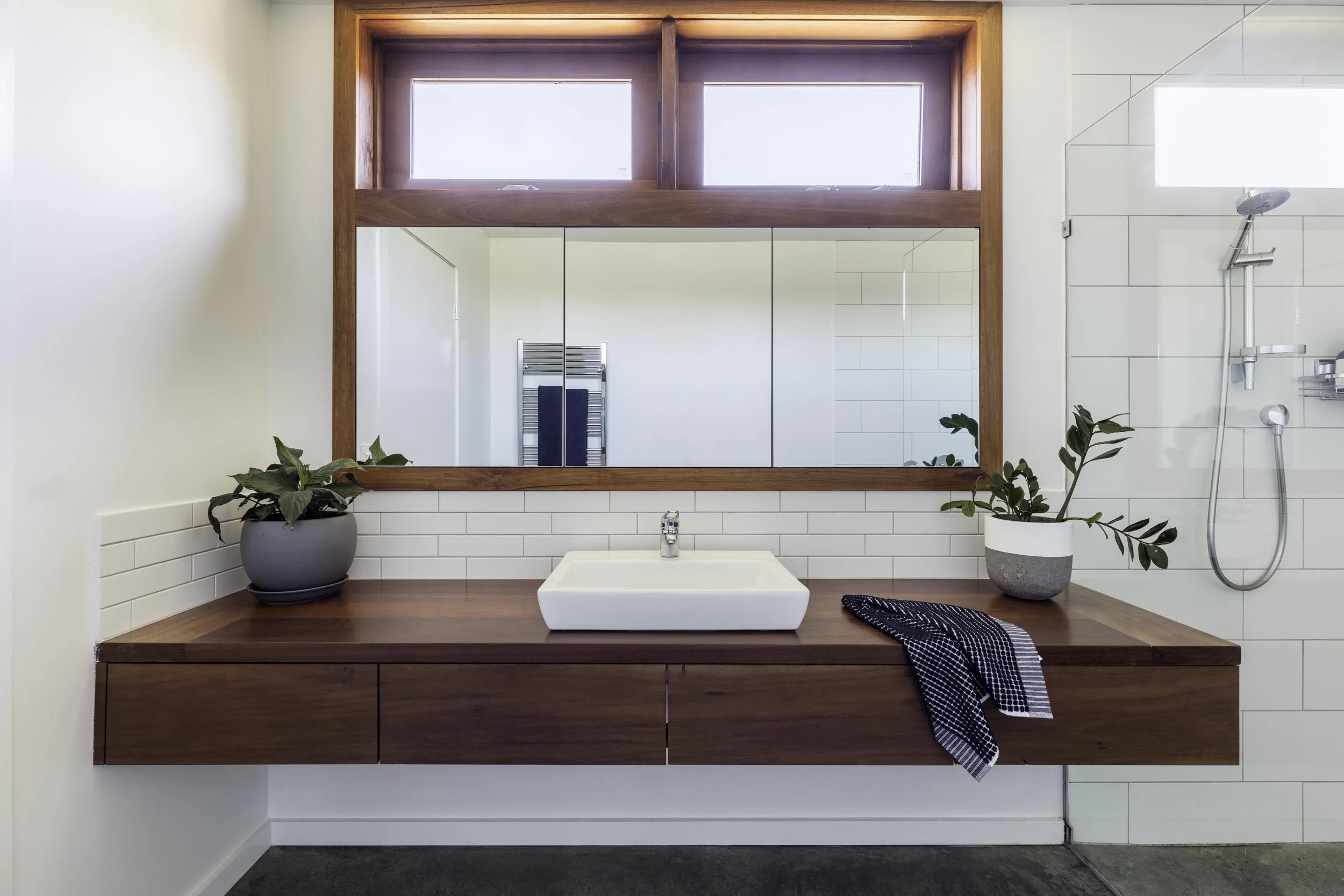 Ironbark timber wall hung vanity with semi-inset basin