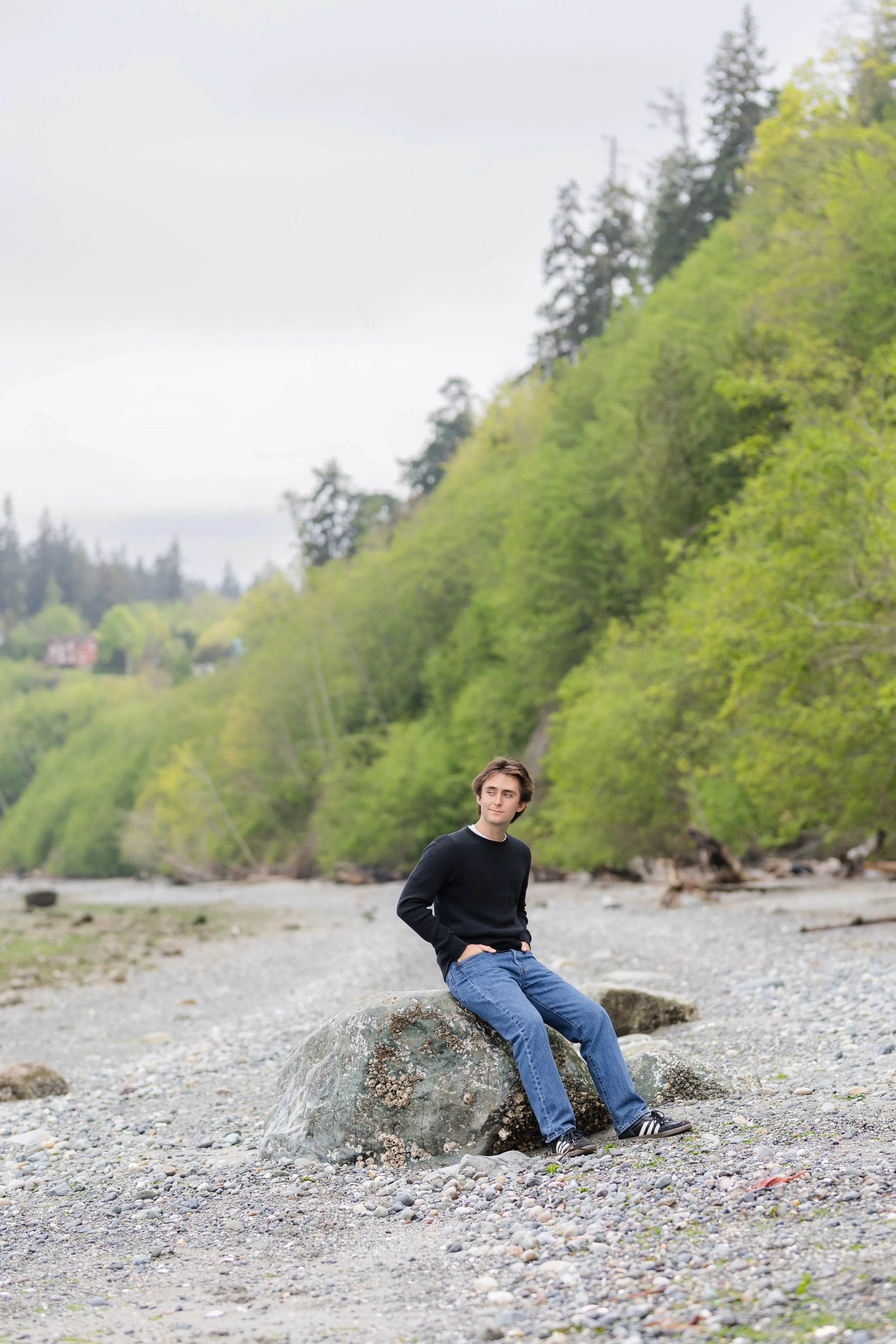Cloudy senior picture taken on a Washington beach