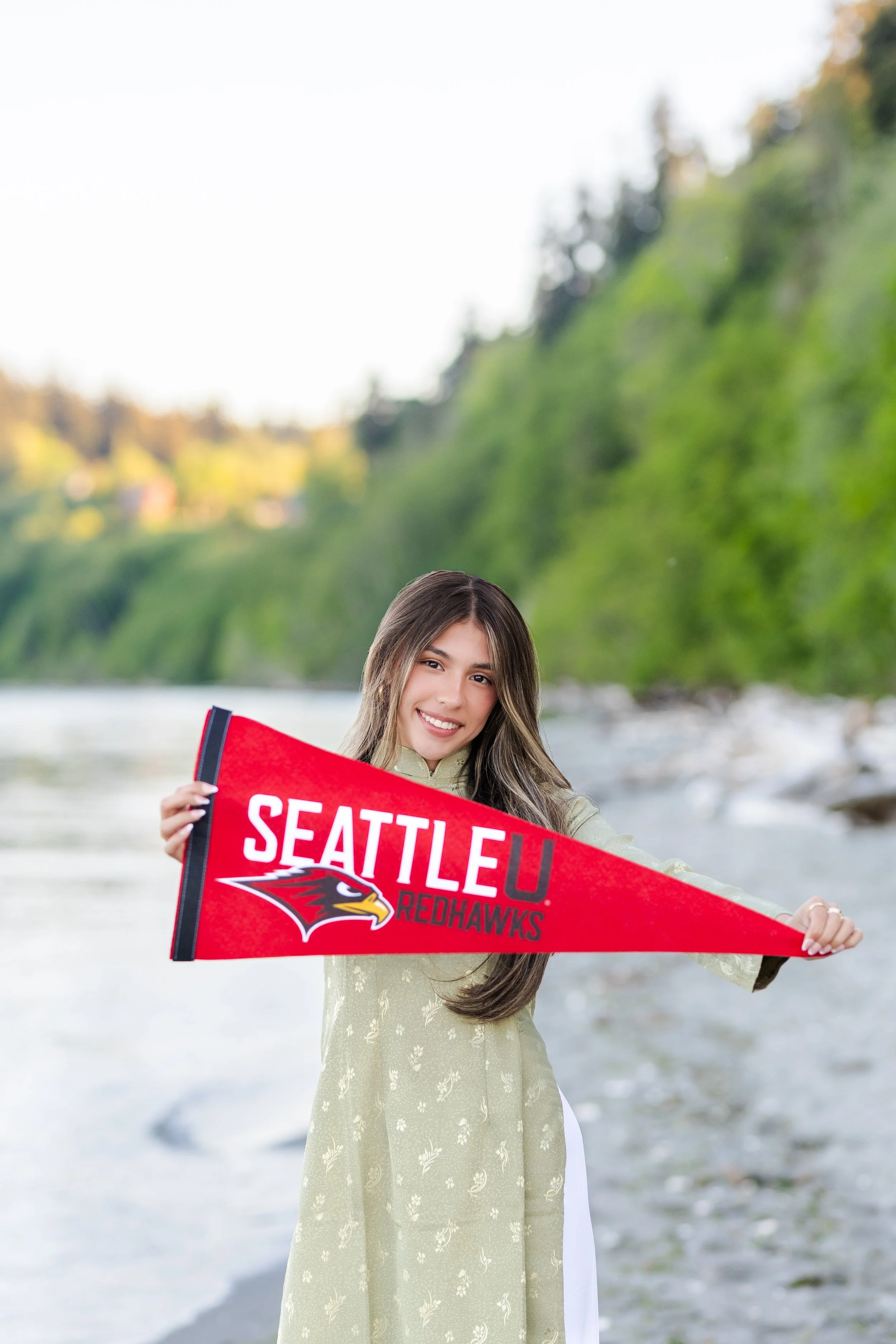 Kitsap senior picture of senior holding Seattle University college pendant for announcement photo