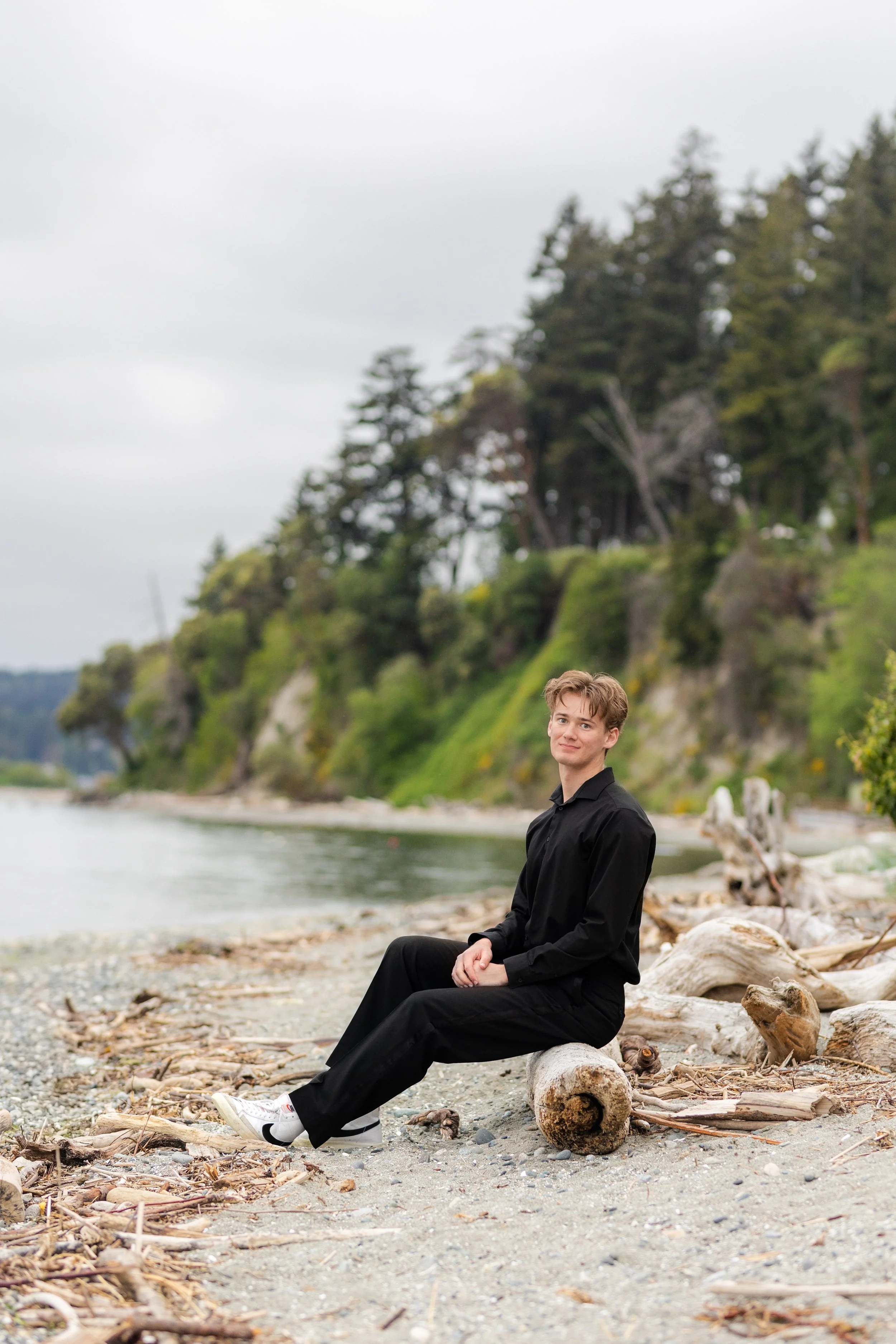 Senior picture of a boy taken on the Indianola beach in Washington
