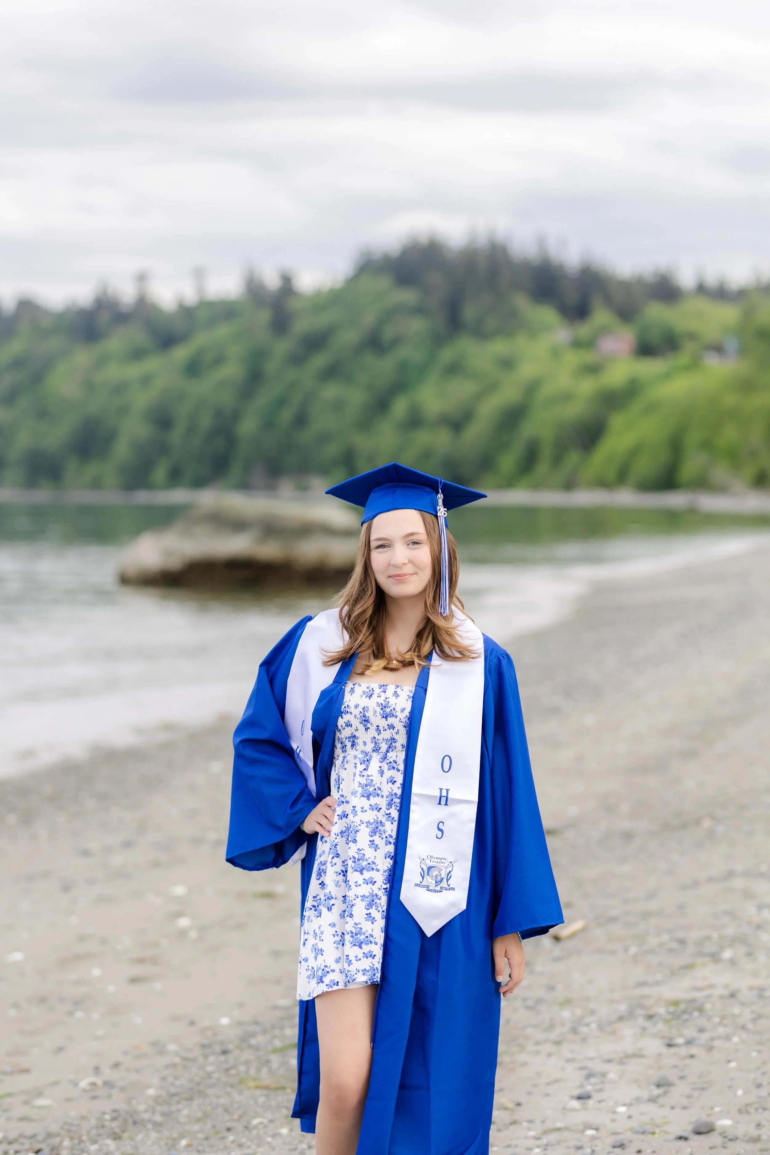 Cap and gown senior picture for an Olympic High School graduate