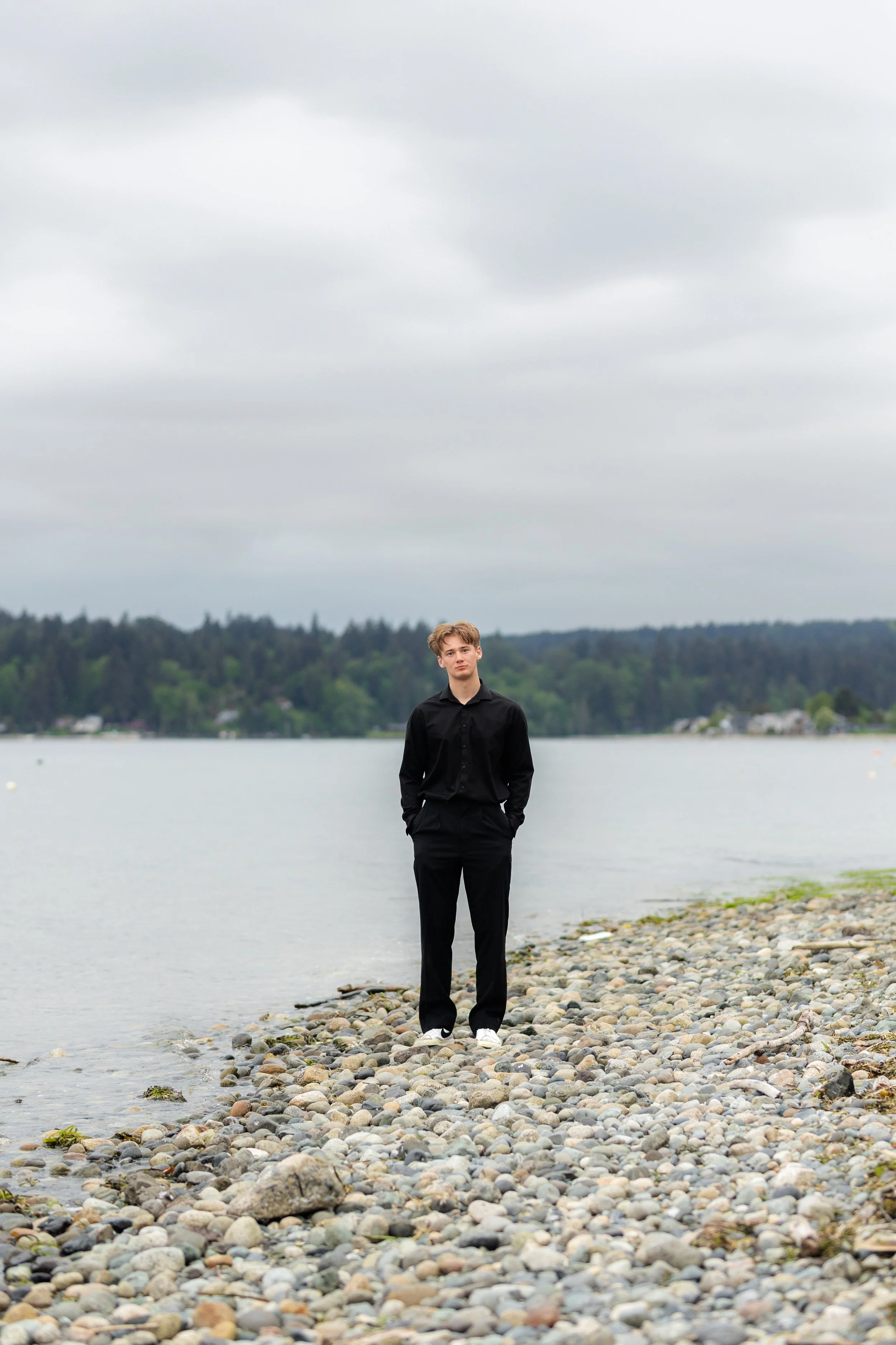 Kingston senior picture taken of a senior boy standing on the beach in Indianola
