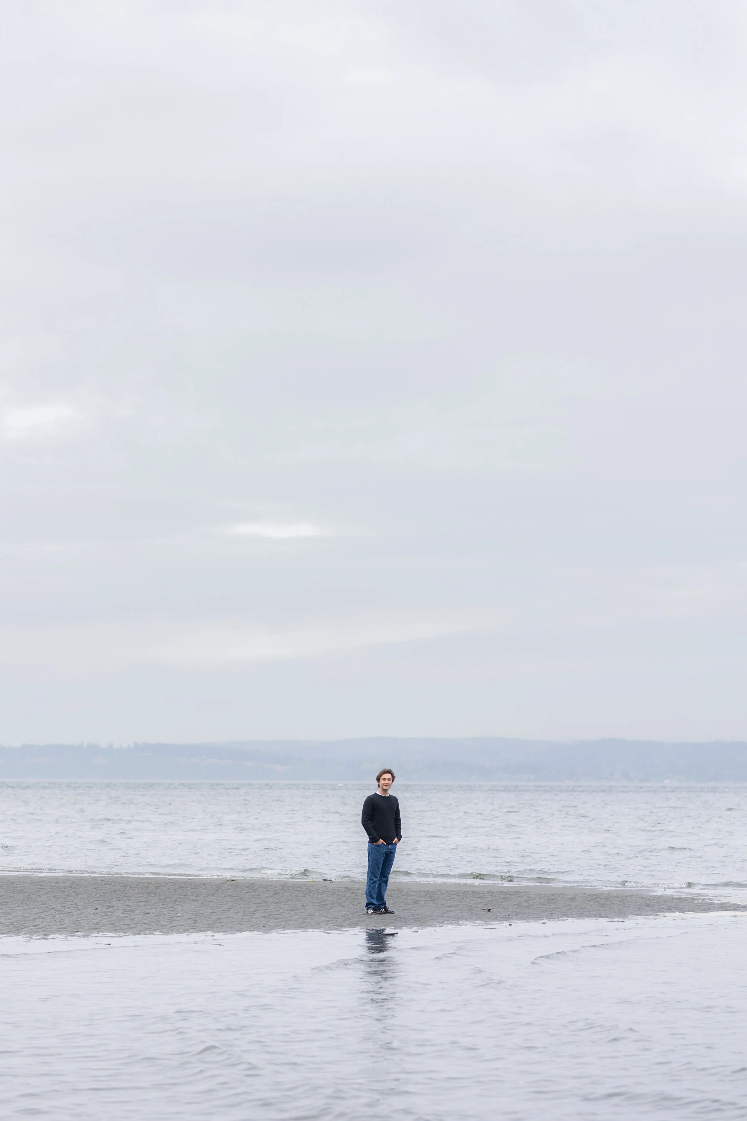 Senior picture of a boy taken at a beach near Kingston, WA