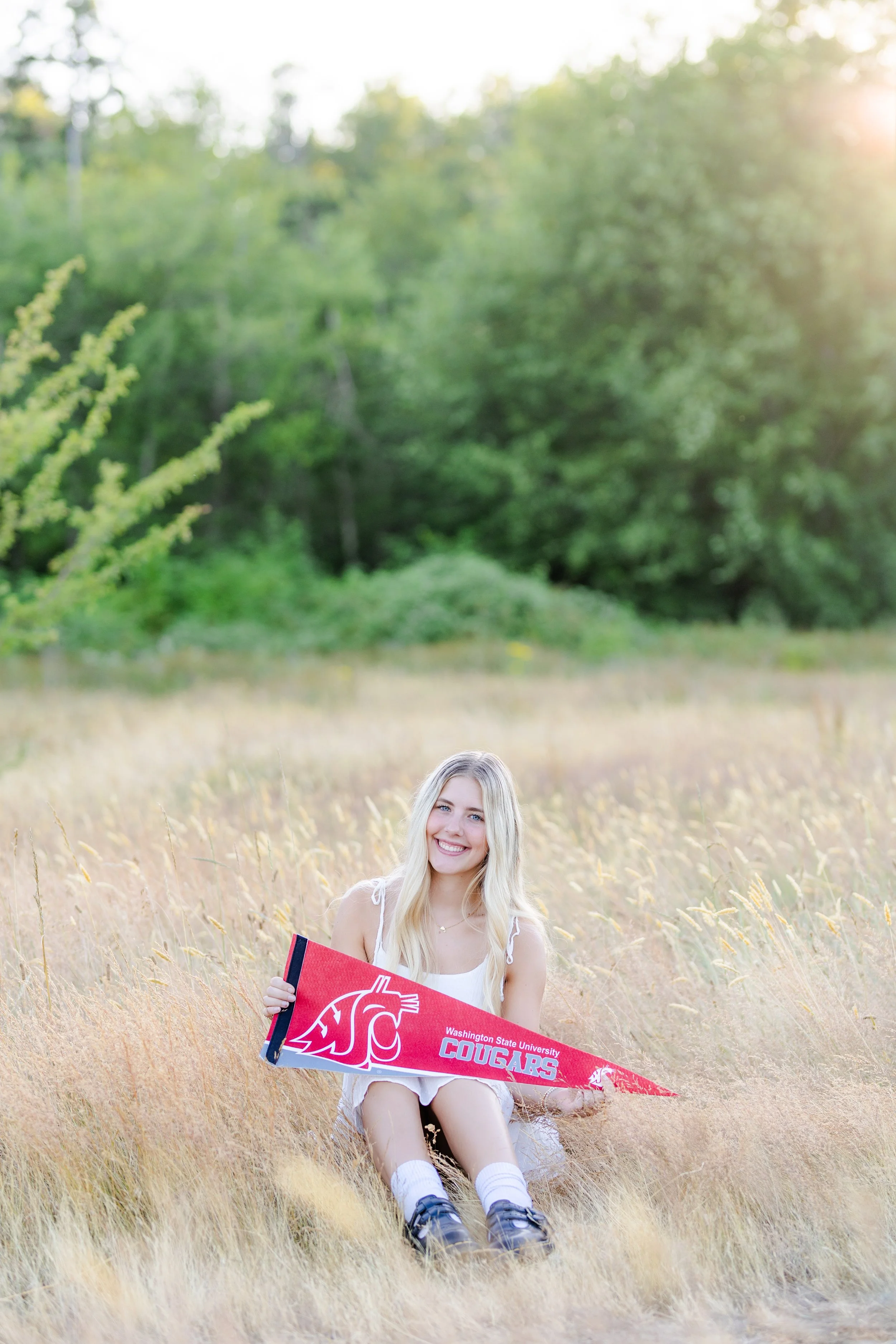 Central Kitsap graduation photo in grassy field