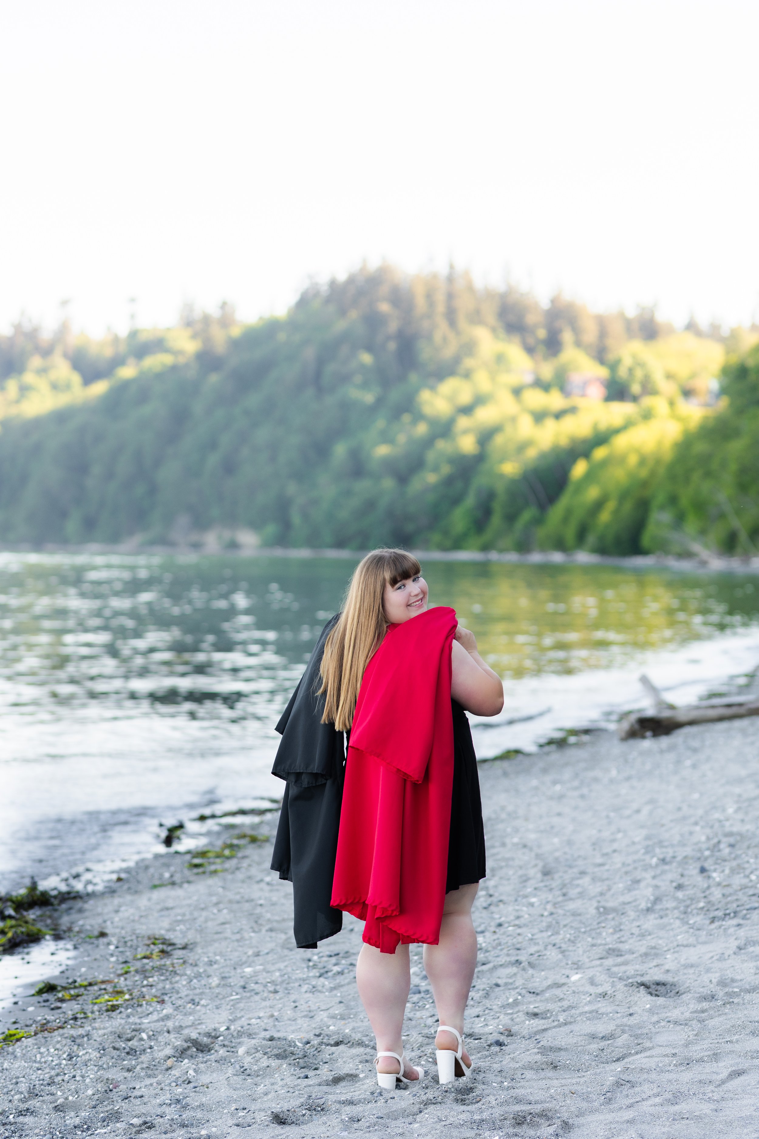 Graduation picture taken with two graduation gowns, one for high school and one for Running Start, in Washington