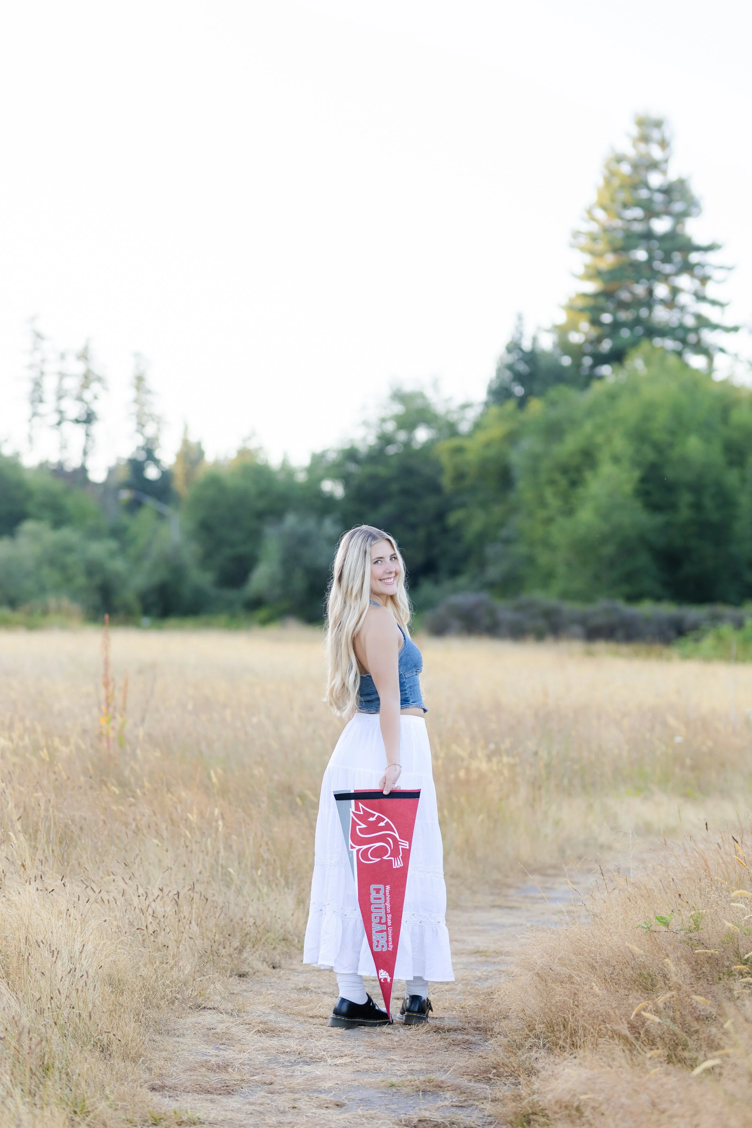 Silverdale graduation photo taken in a field