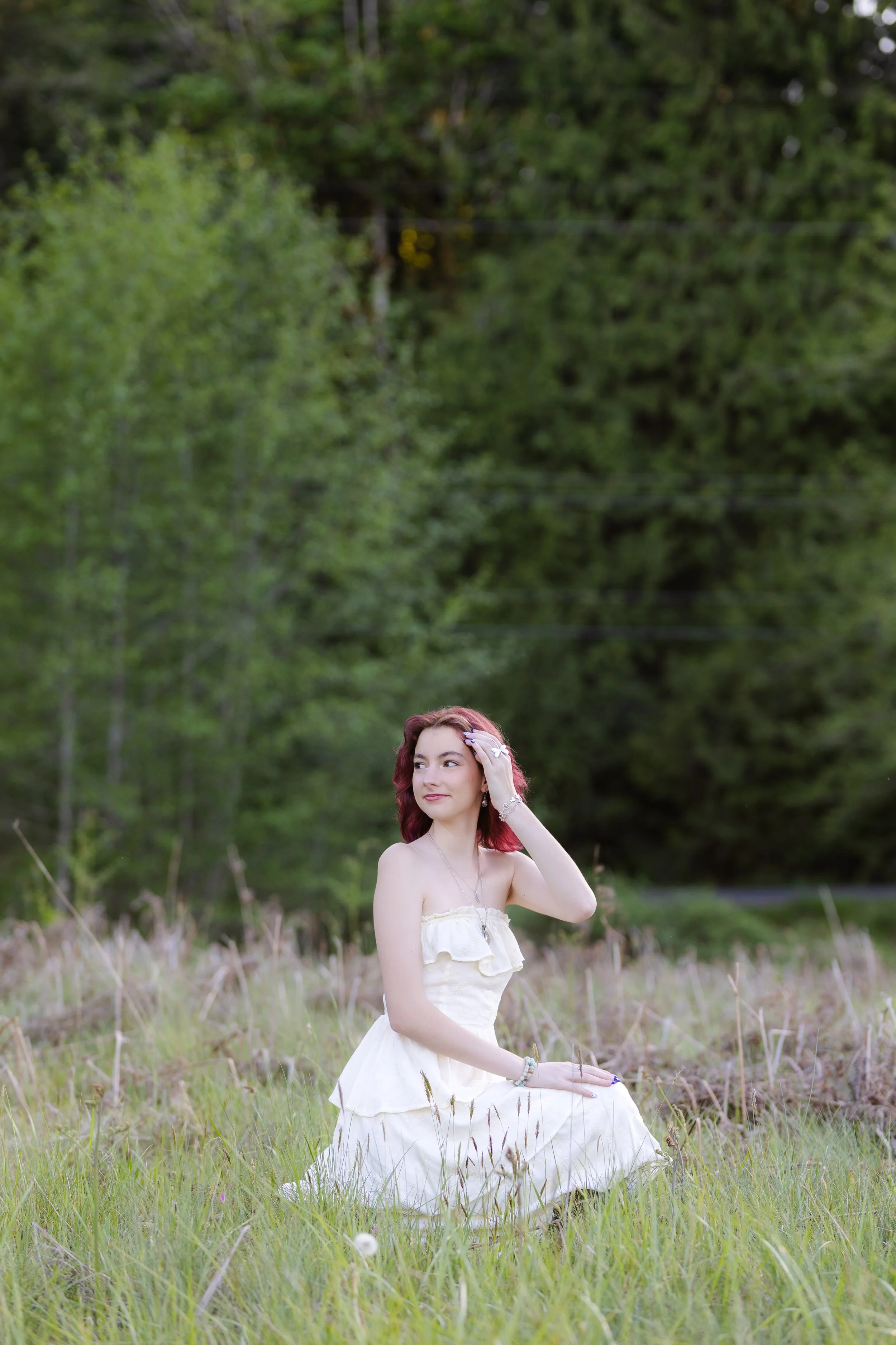Peninsula High School senior picture in a field