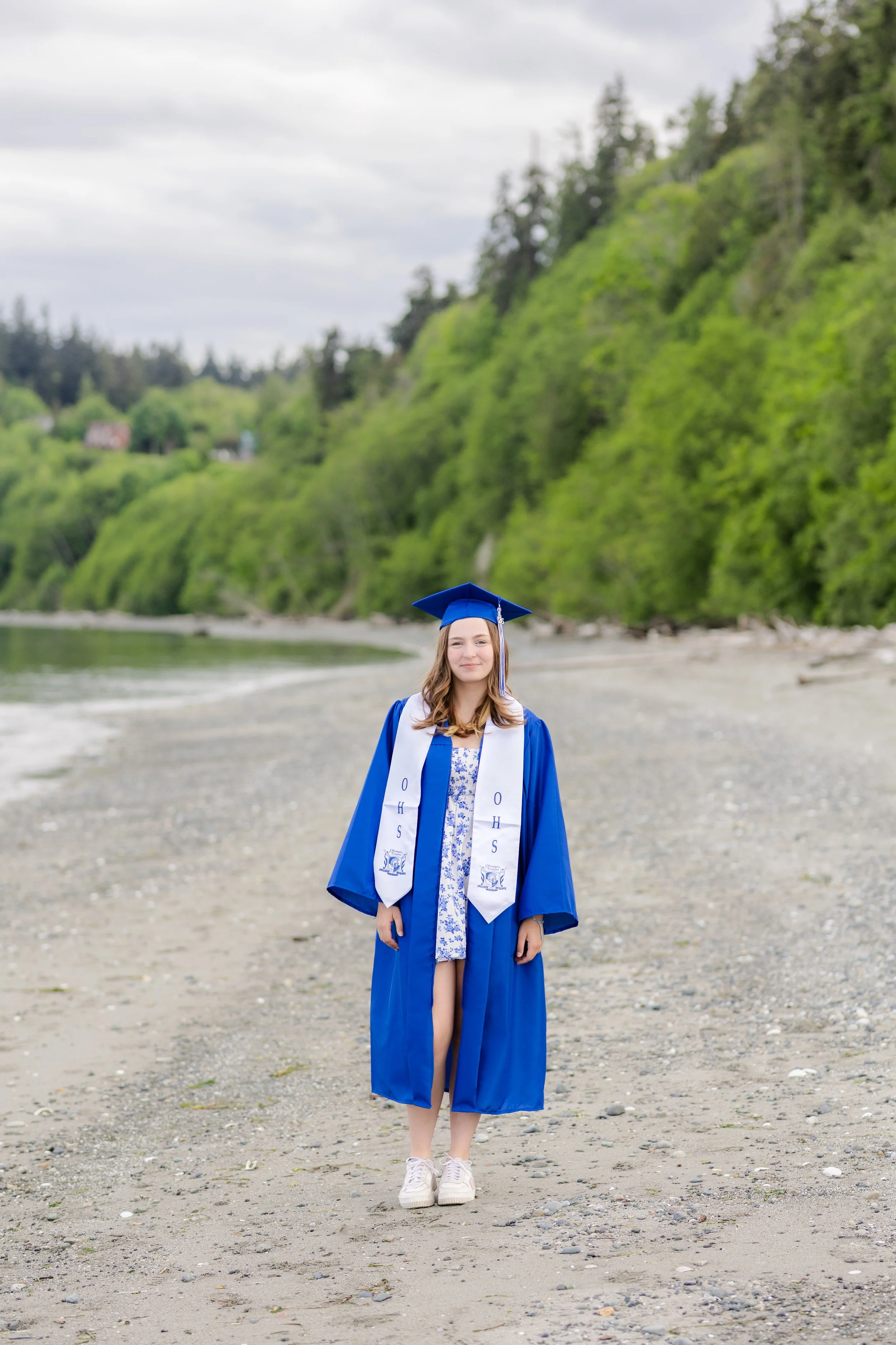 Graduation picture of a senior standing on the beach at Point No Point