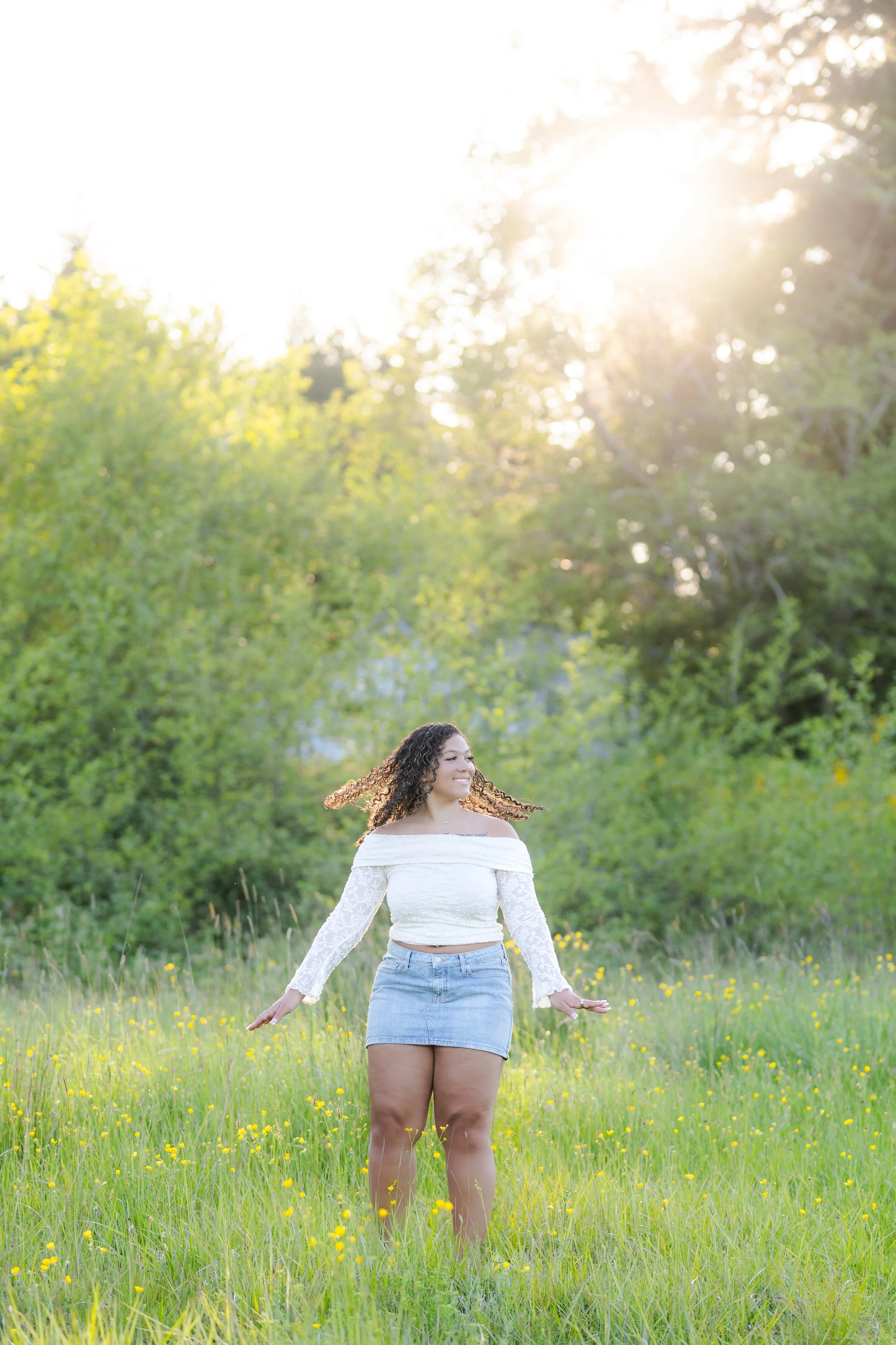 Senior photo taken in South Kitsap in a field with yellow flowers