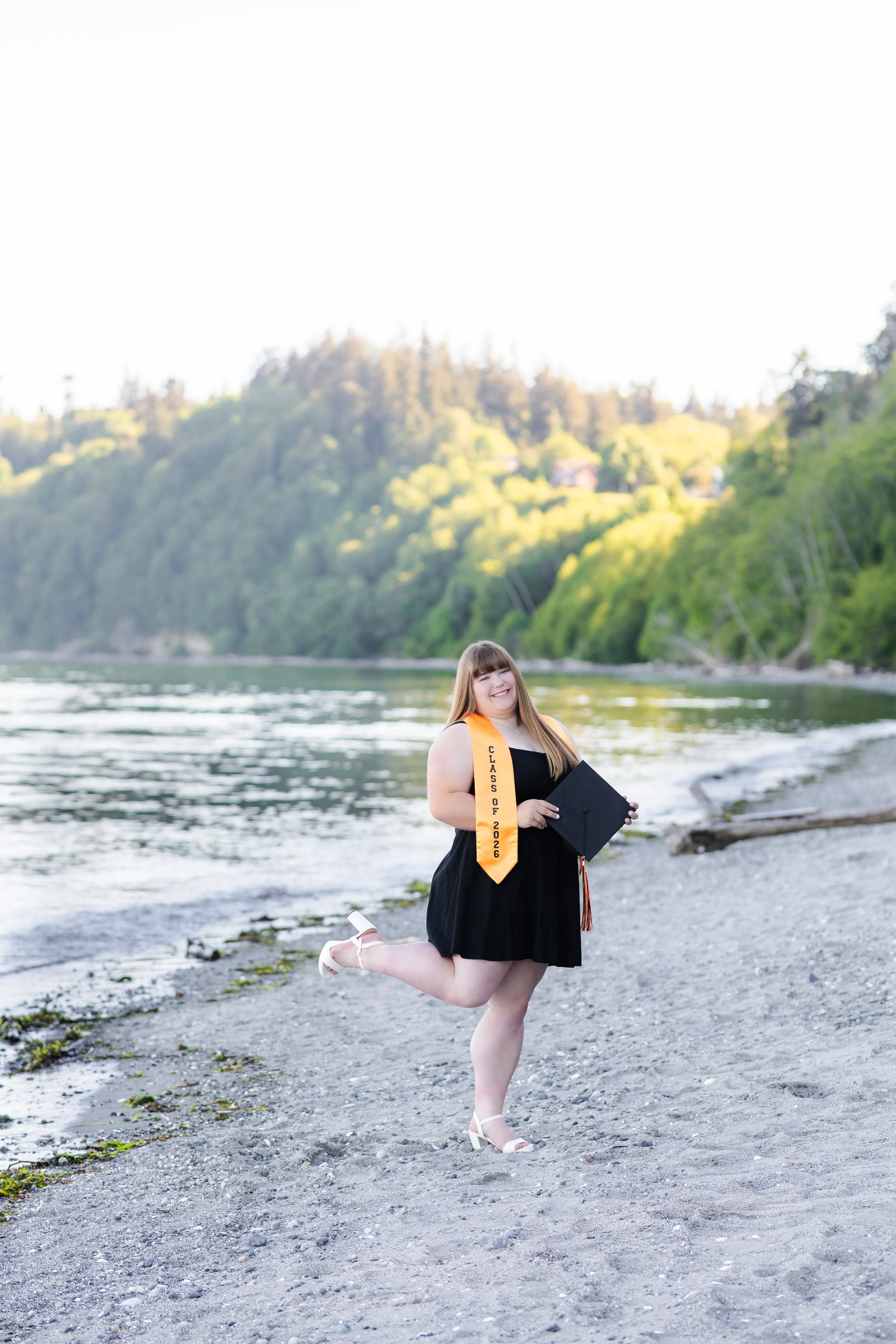 Central Kitsap High School graduation picture with cap and sash at the beach