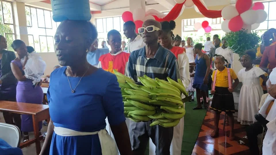 Offertory at the feast of St. Luke's. People bring offerings of food and other gifts. It's a very moving custom.
