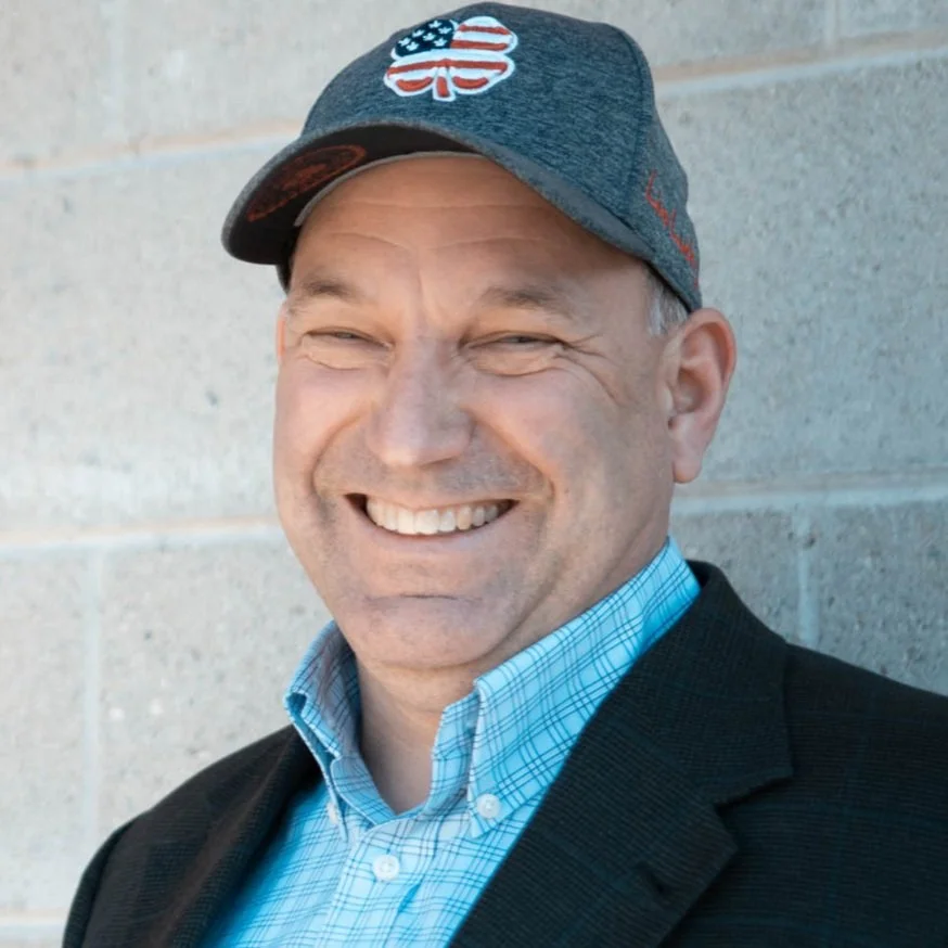 A photo of Brad smiling.