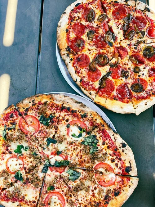 pizzas from Murray’s Restaurant & Deli in Midland, Texas