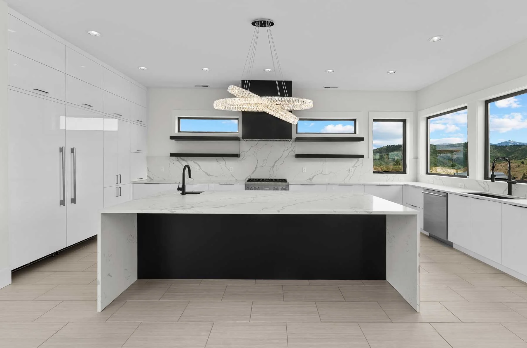 Quartz kitchen island countertop and backsplash in Wenatchee area by Precision Waterjet Inc.