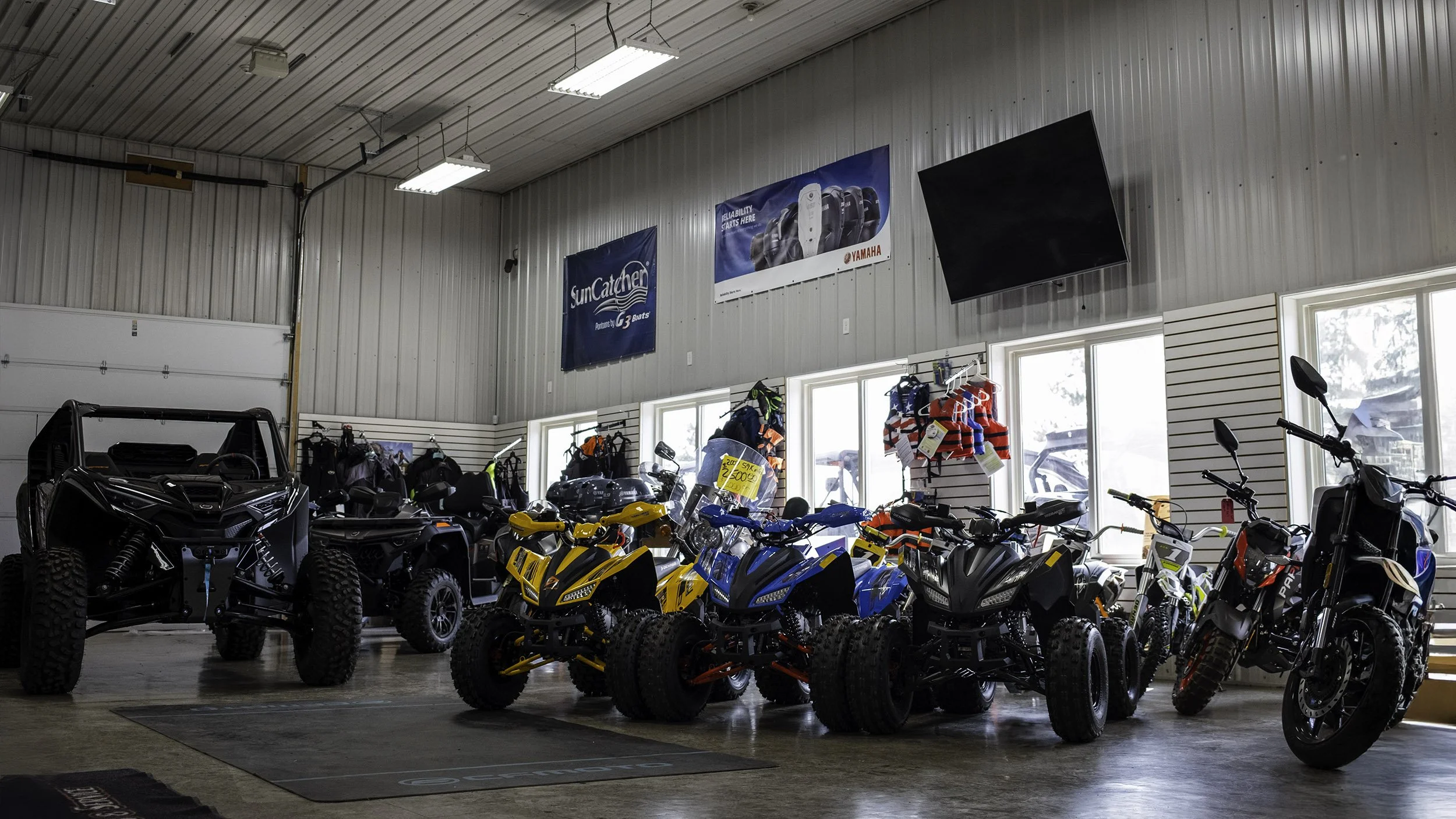 Redline Sport & Marine interior showroom with ATVs, UTVs and motorbikes