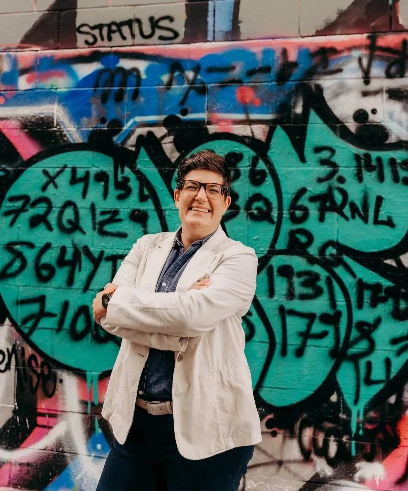 Francesca McLin, copywriter and strategist, in front of an iconic graffiti wall in her hometown