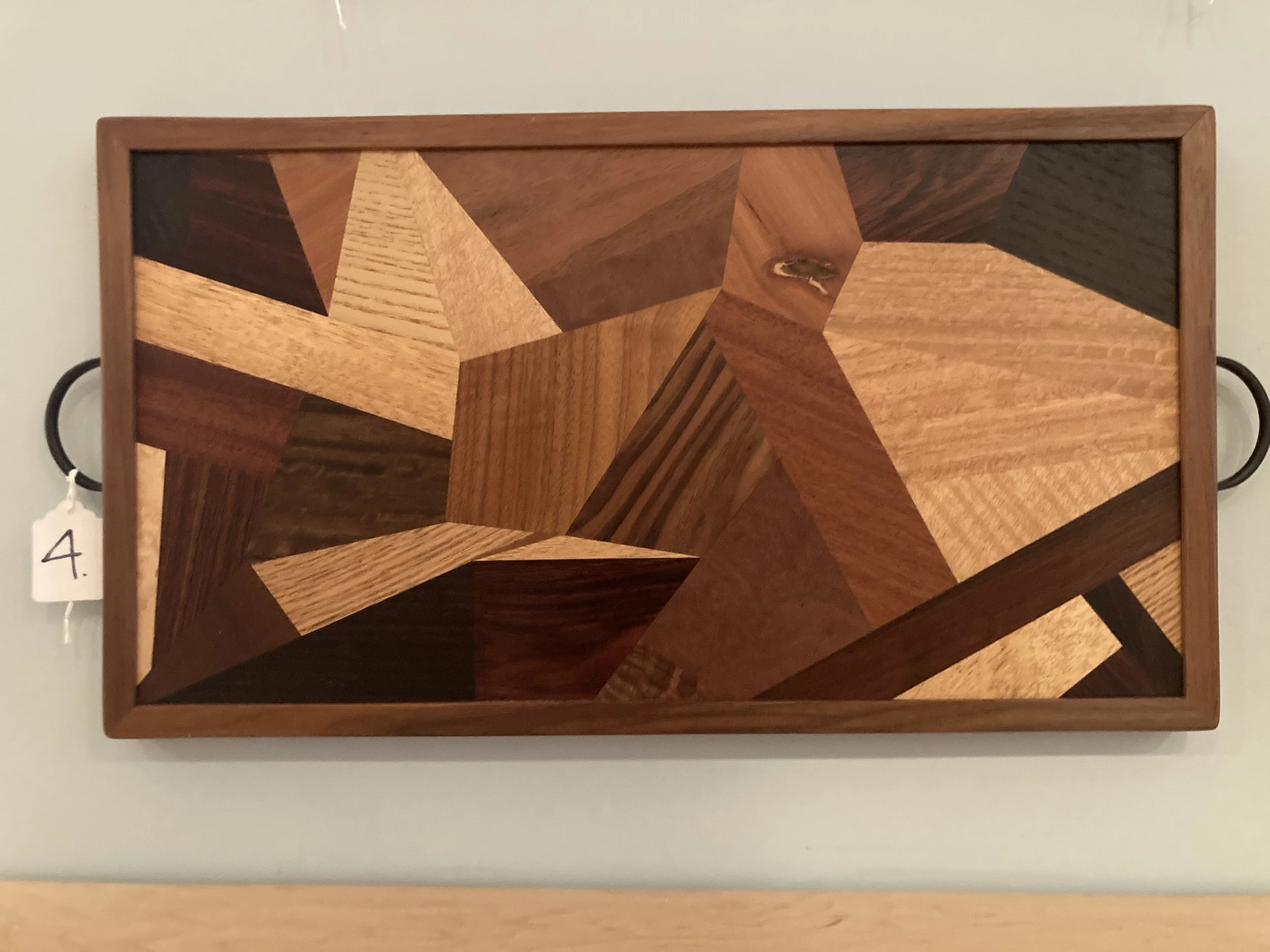 Wooden tray with intricate geometric inlay pattern