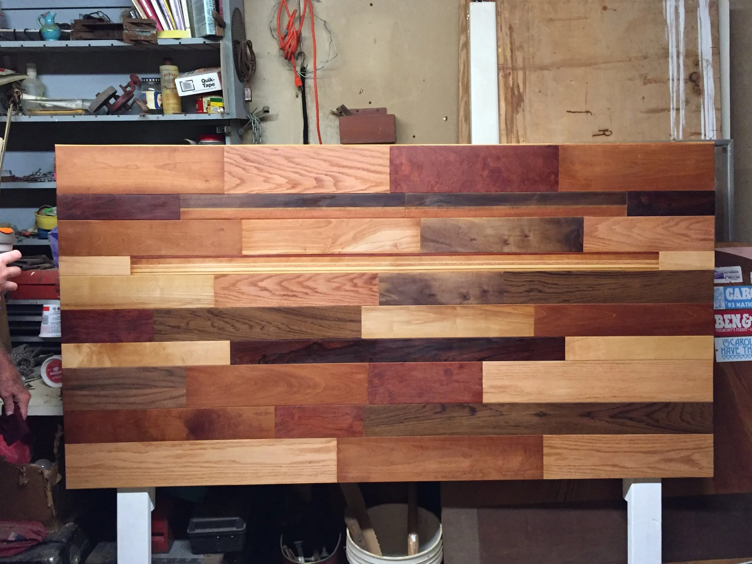 wood panel with mixed timber planks in workshop