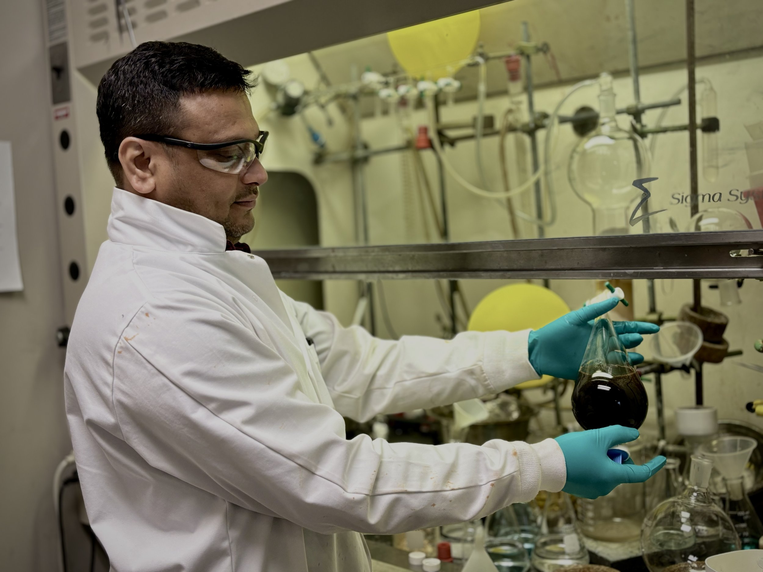 chemist_holding_bottle.jpeg