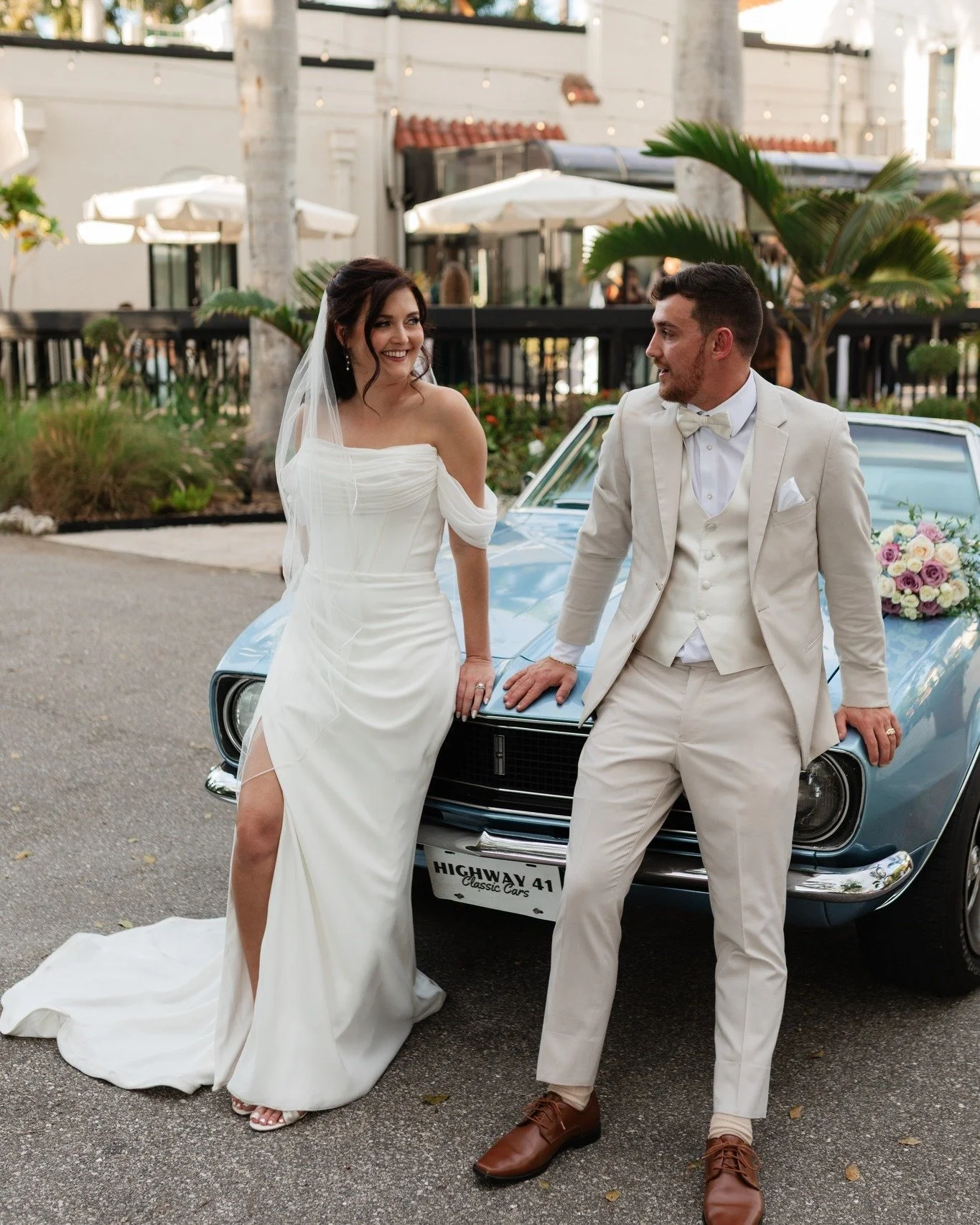 Something old.
Something new.
Something borrowed.
Something blue. 🏁

A timeless love story sealed with a kiss beside a classic blue beauty. We love when meaningful traditions blend seamlessly with timeless details. We'll be swooning over Mallory and