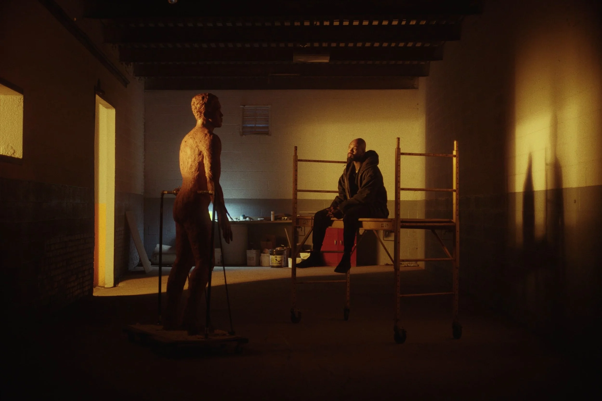 Image still from the short documentary film My Hands Purpose by Detroit based director John Sippel. Sculptor Austen Brantley sculpting process of making a tribute to Joe Louis breaking the color barrier in the PGA inside his studio. 