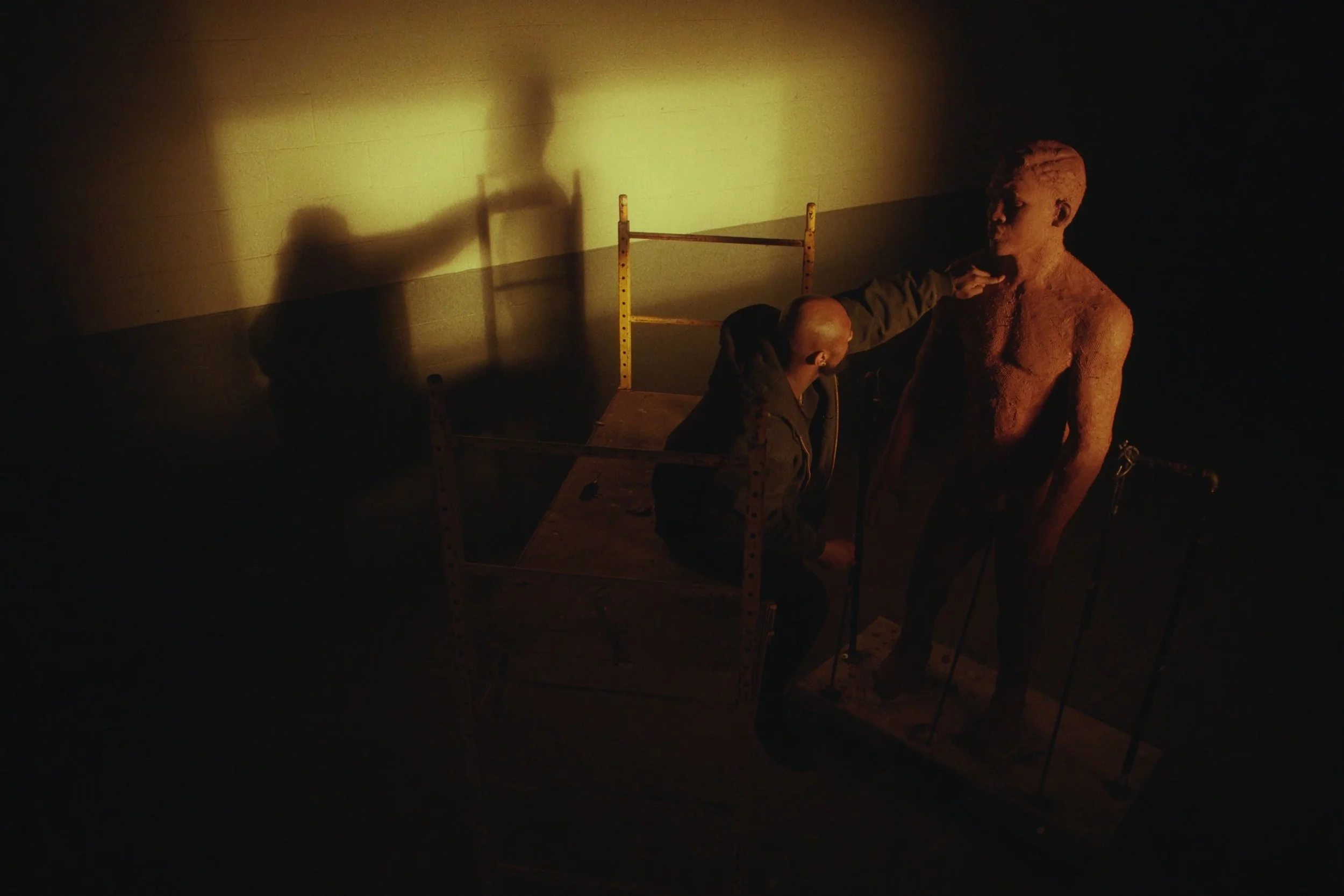 Image still from the short documentary film My Hands Purpose by Detroit based director John Sippel. Sculptor Austen Brantley sculpting process of making a tribute to Joe Louis breaking the color barrier in the PGA inside his studio. 