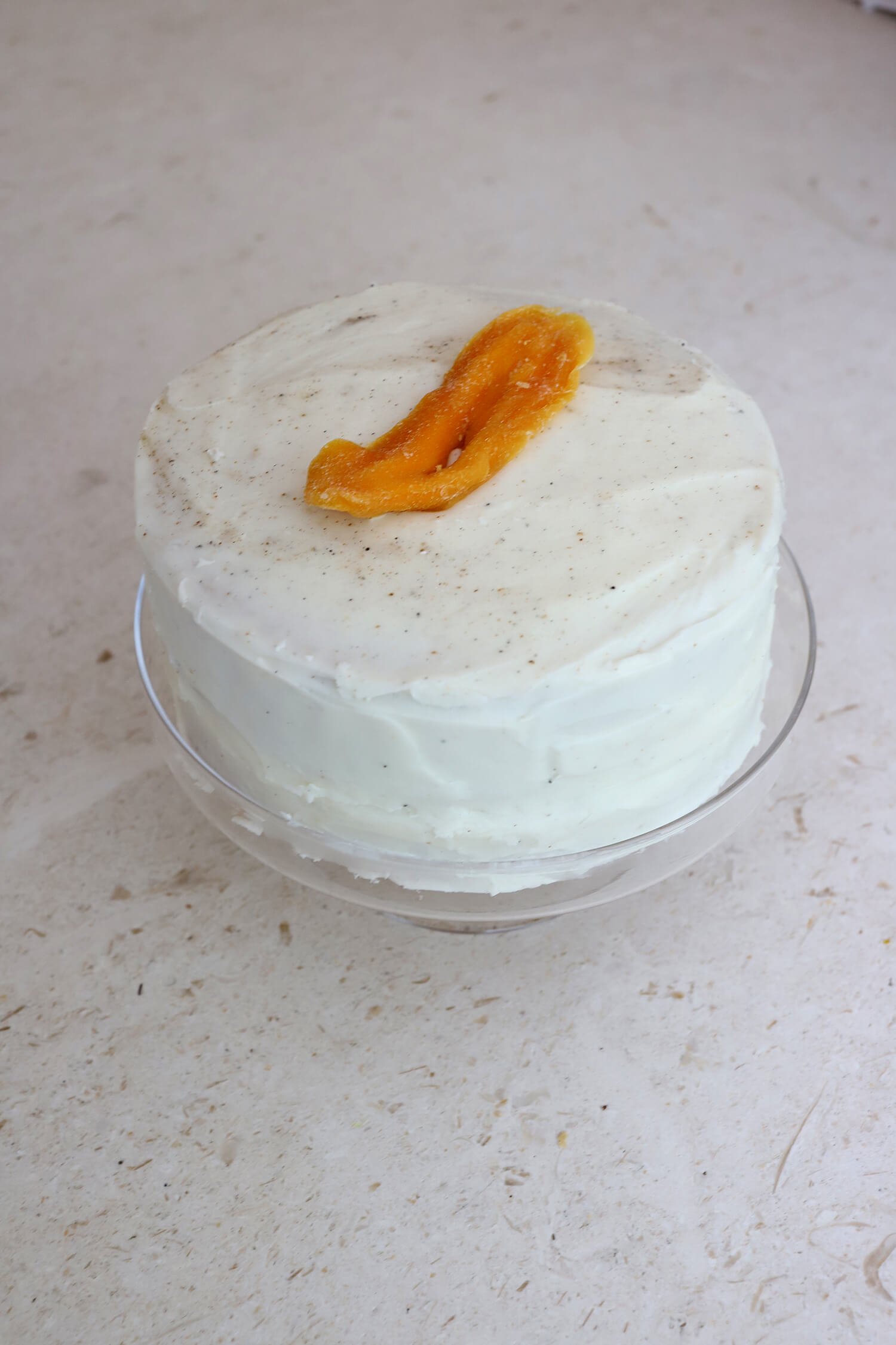 COCONUT MANGO CAKE WITH CARDAMOM CREAM CHEESE FROSTING