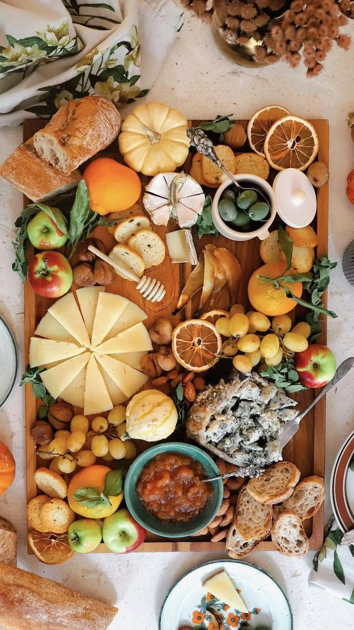 Lush Fall Thanksgiving Cheeseboard filled with warm seasonal flavors.