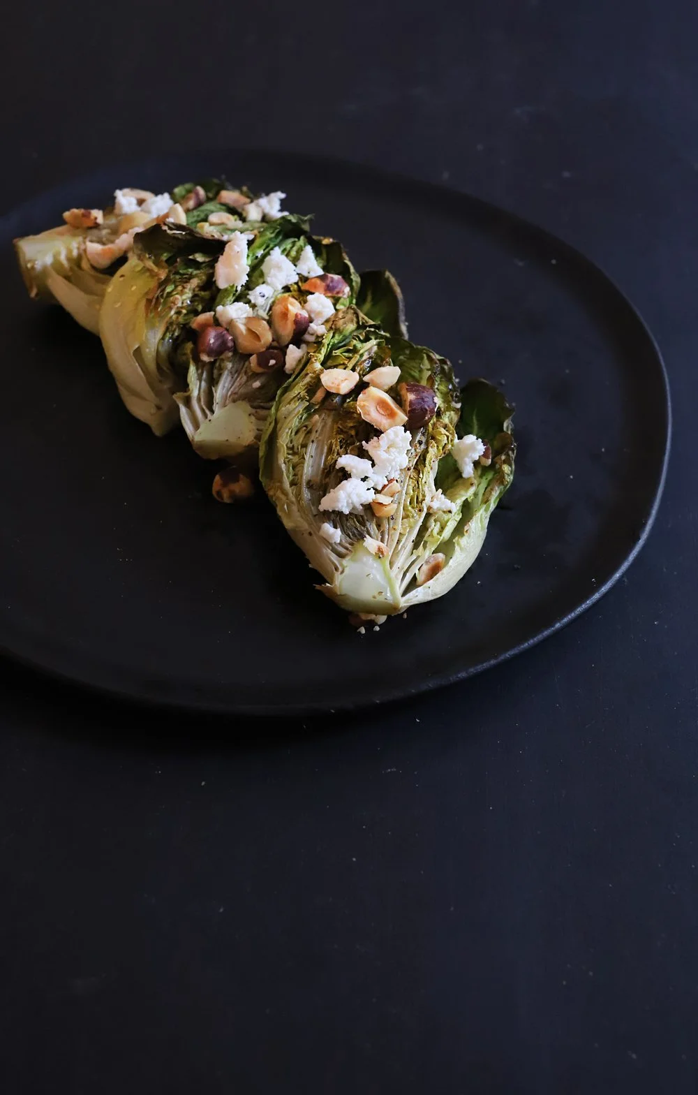 ROASTED BIBB LETTUCE SALAD WITH HAZELNUTS, HONEY, AND TRUFFLE GOAT CHEESE