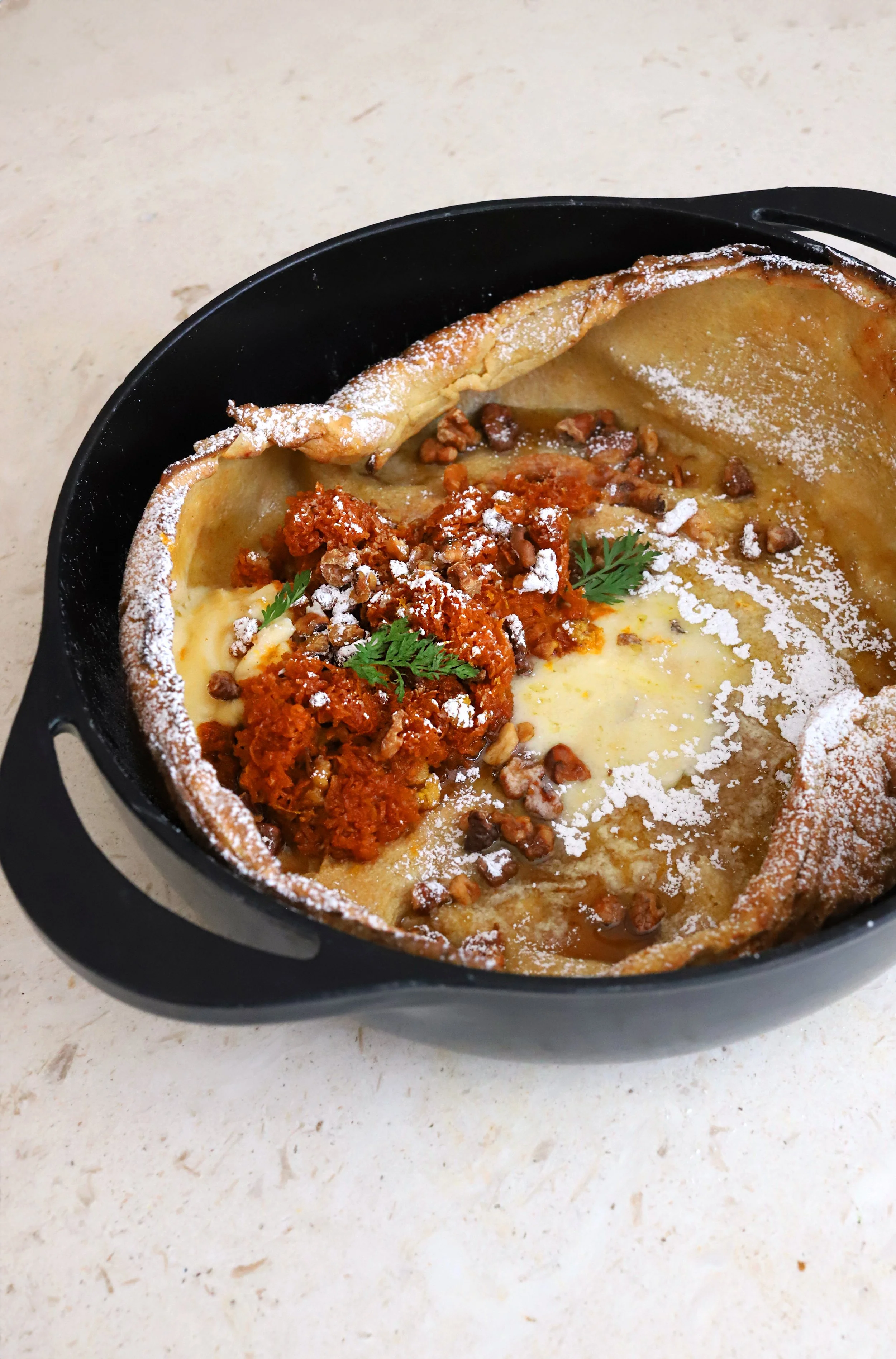 VANILLA DUTCH BABY WITH CARROT CAKE SPICED COMPOTE