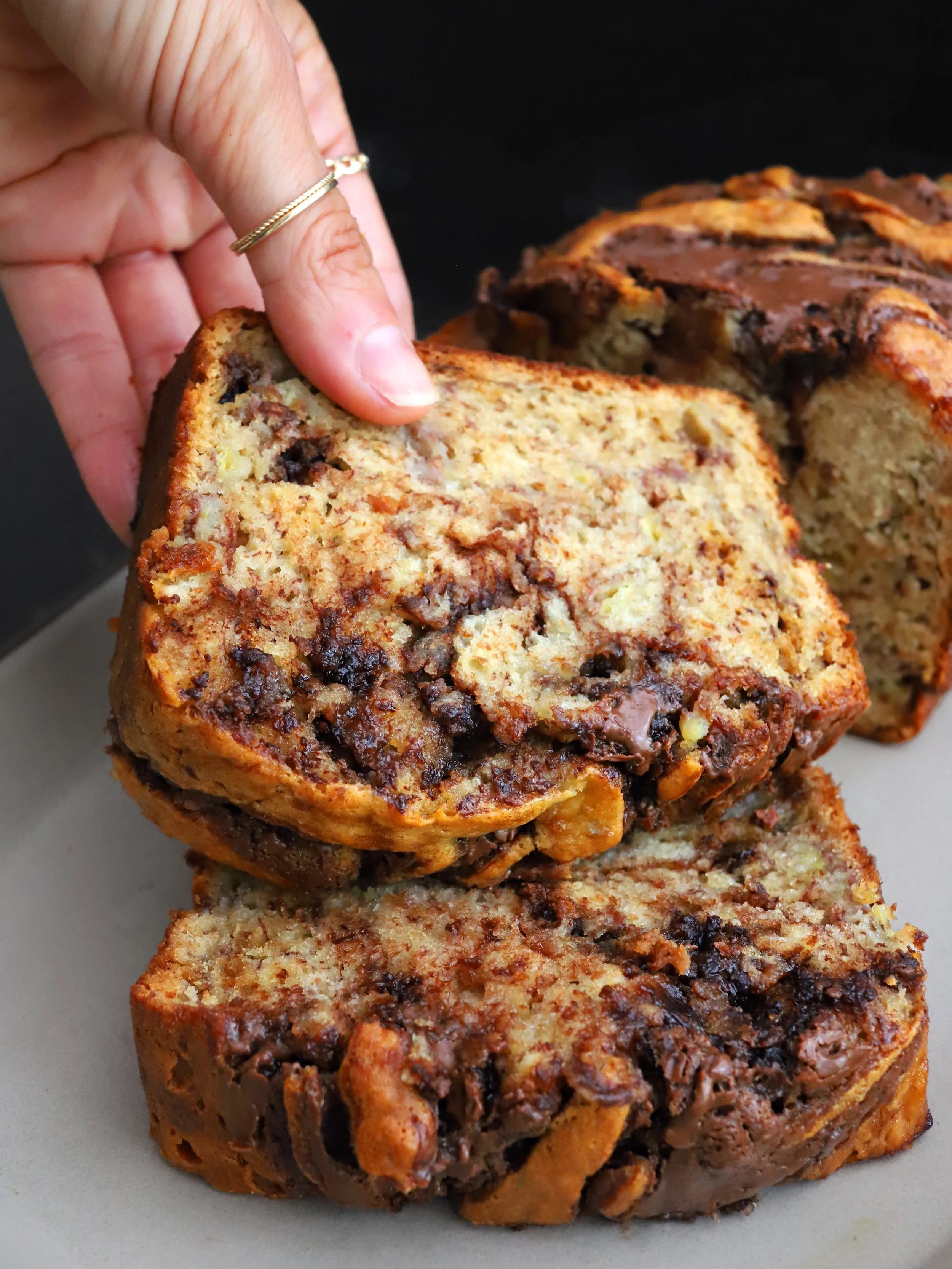 You wanna get nut(ella)s? Let&rsquo;s get nut(ella)s!

I added Nutella to my basic B banana bread recipe, and now&hellip; it&rsquo;s everything! It&rsquo;s rich, crumbly, and moist on the inside with a perfect marbled sheen crust on the outside. It&r
