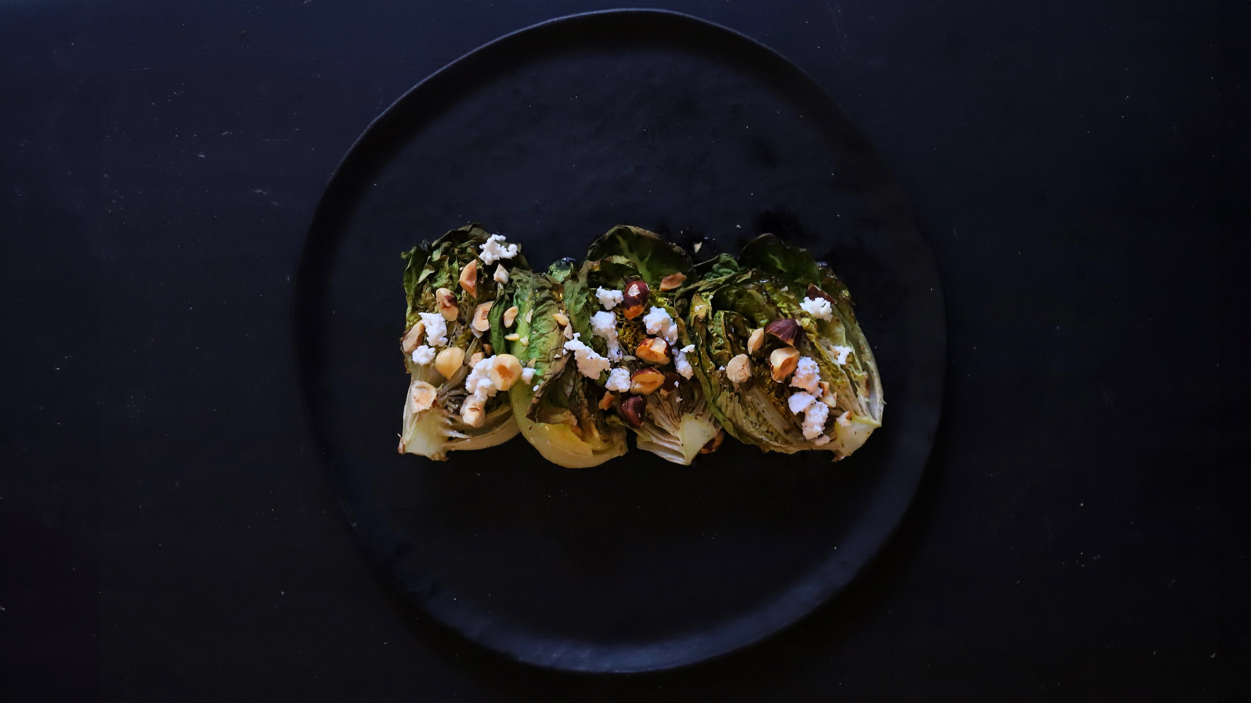 ROASTED BIBB LETTUCE SALAD WITH HAZELNUTS, HONEY, AND TRUFFLE GOAT CHEESE