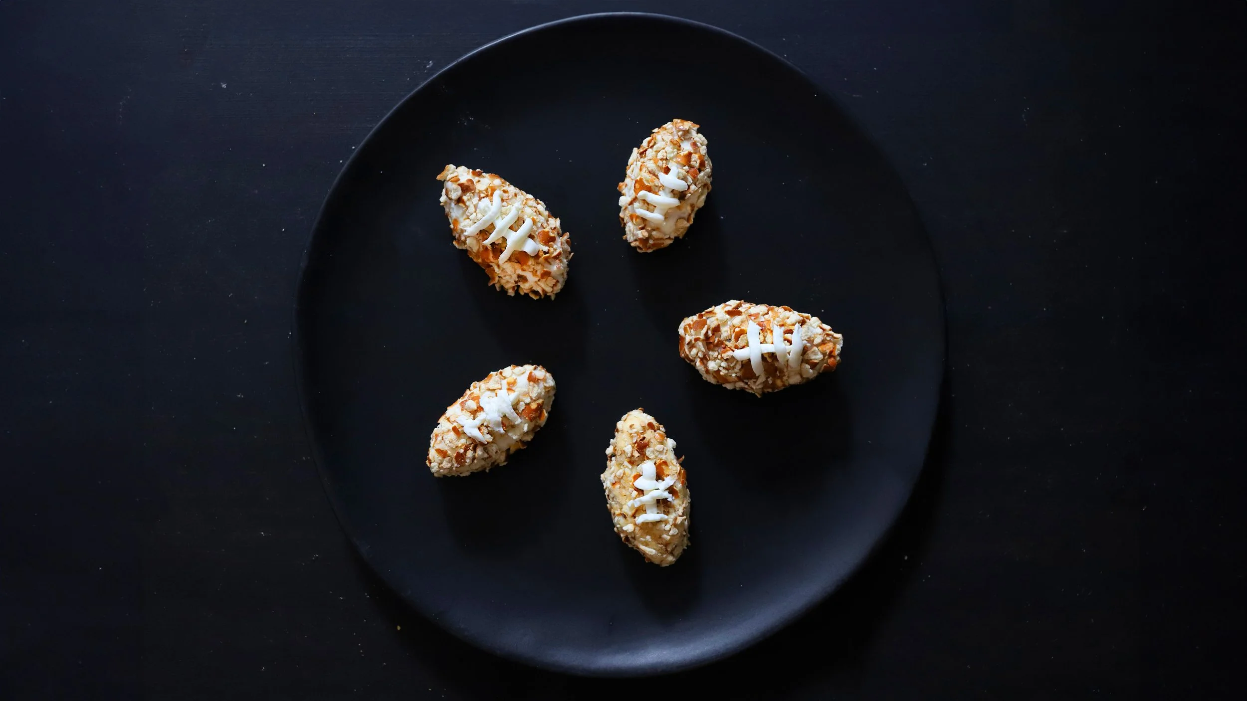 FOOTBALL SHAPED PRETZEL-CRUSTED HONEY TRUFFLE GOAT CHEESE BITES