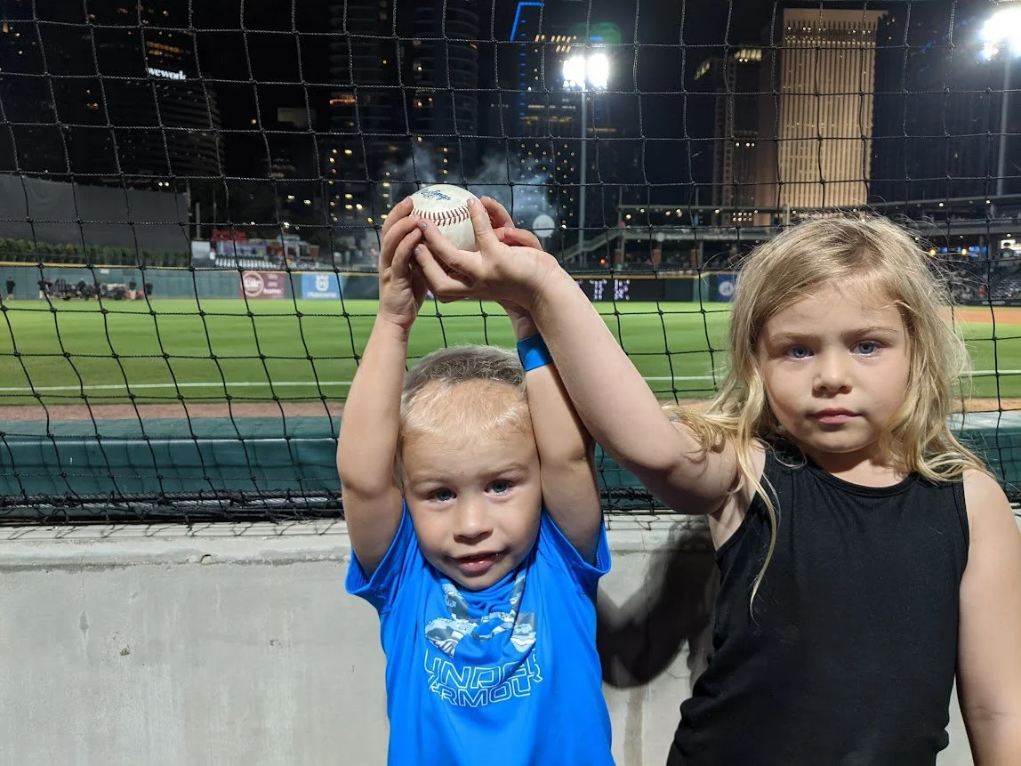 Maya proud she helped Mason get his  first baseball at a  Charlotte Knights game,