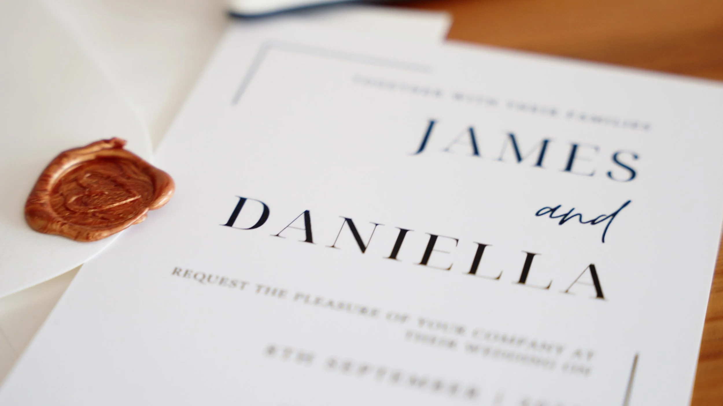 Wedding invitation with a wax seal on the envelope, announcing the marriage of James and Danielle.