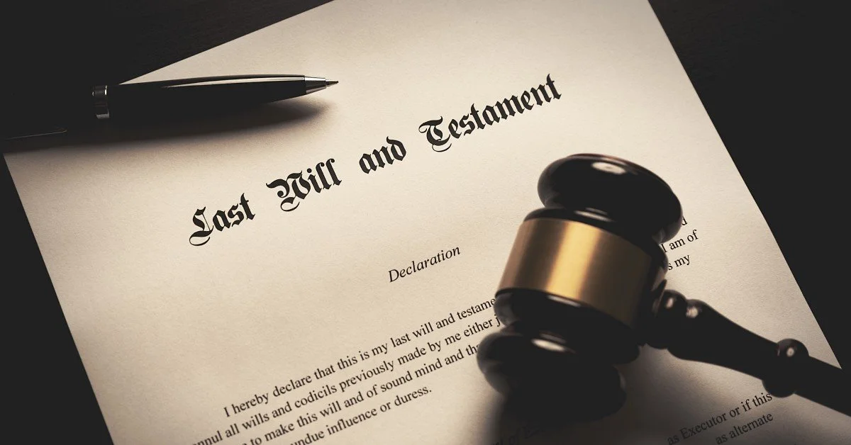 A Last Will and Testament sits on a dark surface with a black pen and a judge's gavel, symbolizing estate planning.