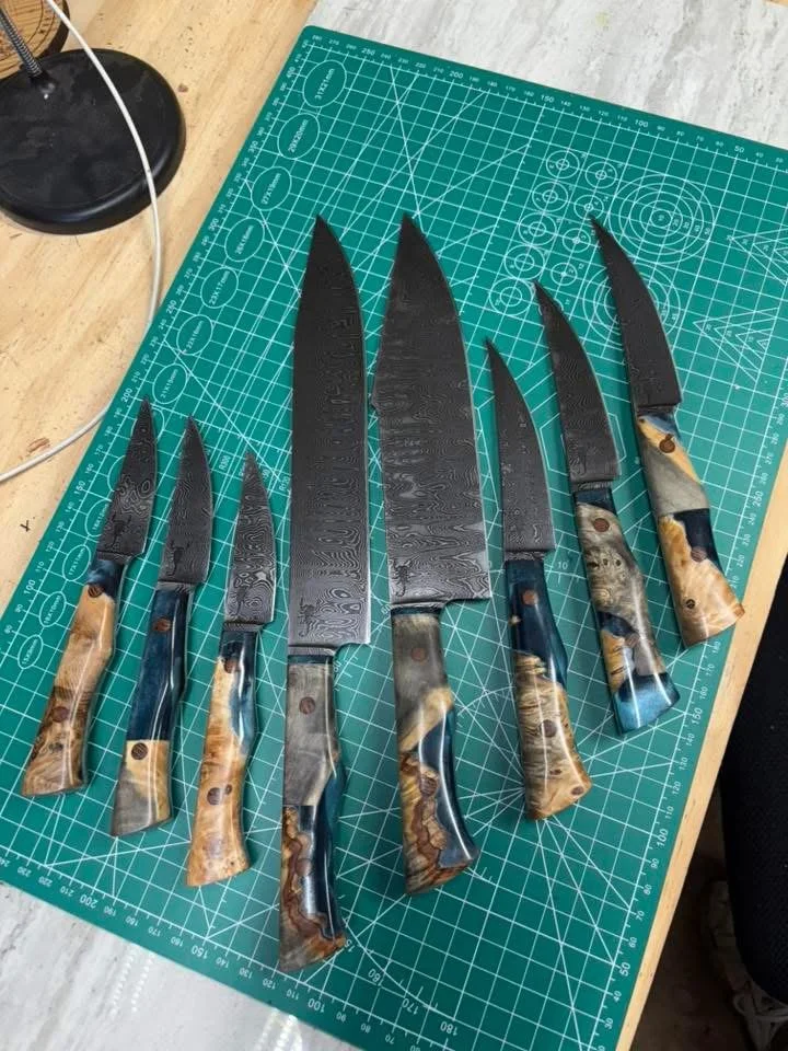 8 piece Damascus Kitchen set made from hybrid handles cast in epoxy.