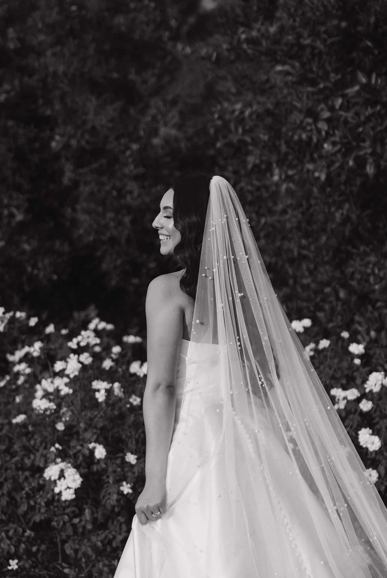 Editorial photographer takes a candid photo of bride during her wedding in Los Angeles California.