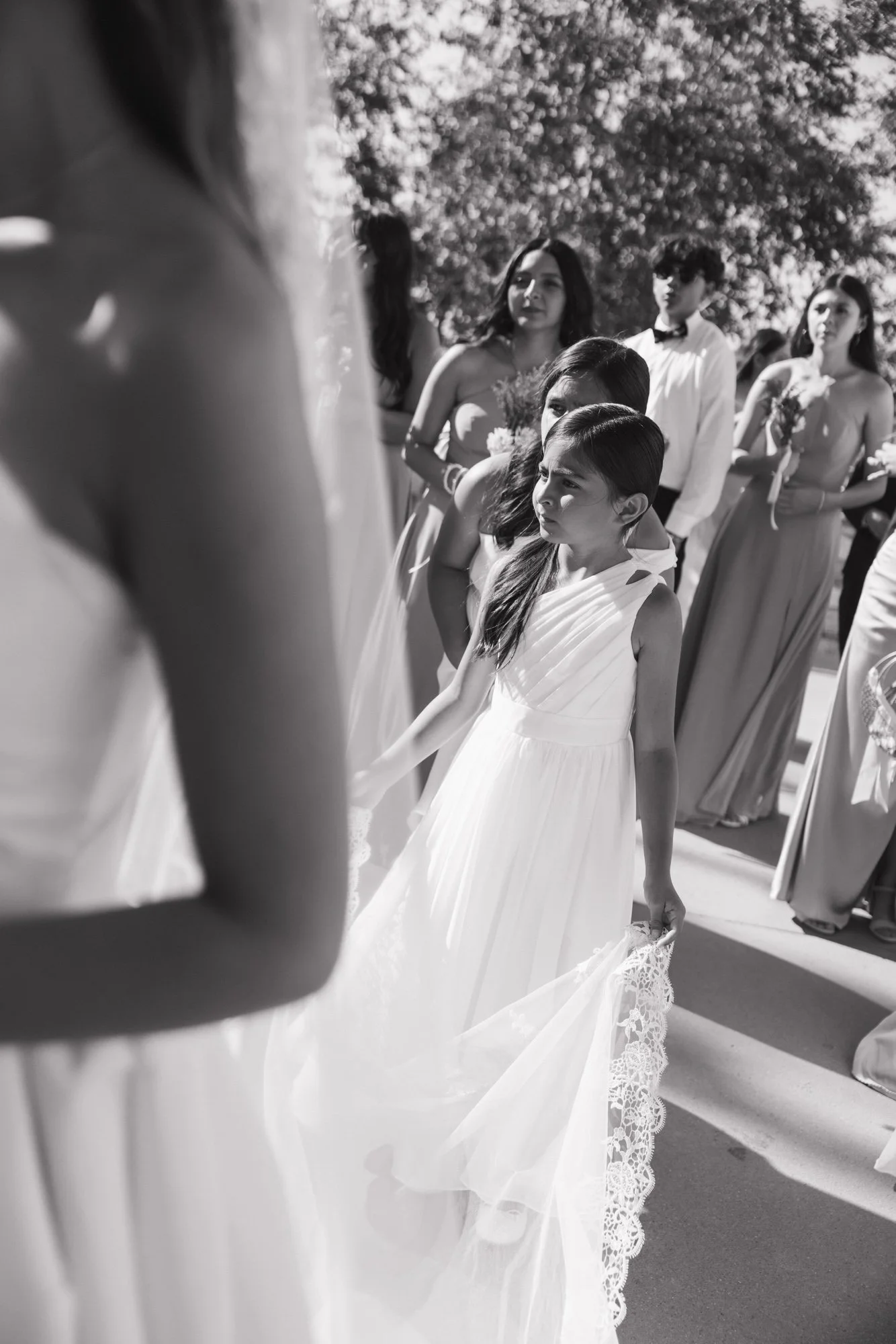 Editorial photographer takes candid photo of flower girl during a wedding in Southern California.